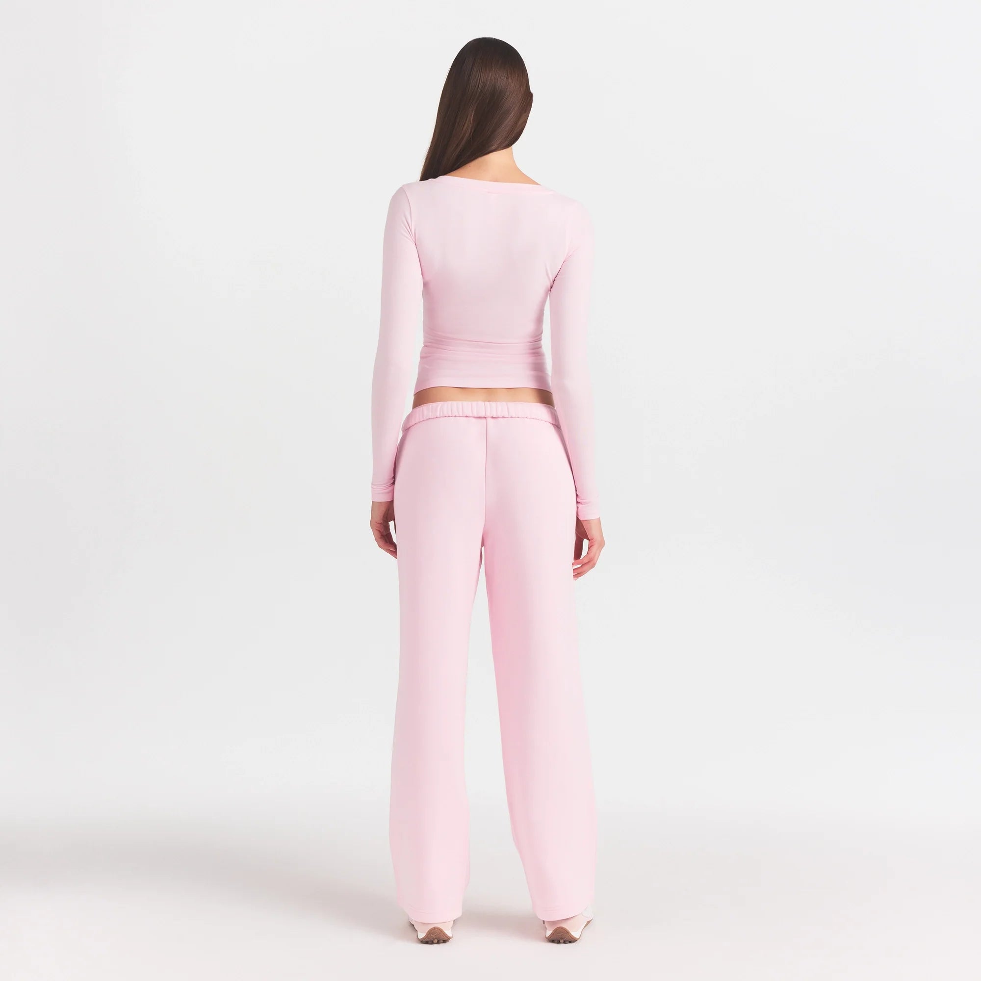 COTTON FLEECE STRAIGHT LEG PANT WITH EMBOSSED LOGO | CHERRY BLOSSOM ON A MODEL FRONT VIEW @ | FOCUS: 0.0, 1.0, 0.9