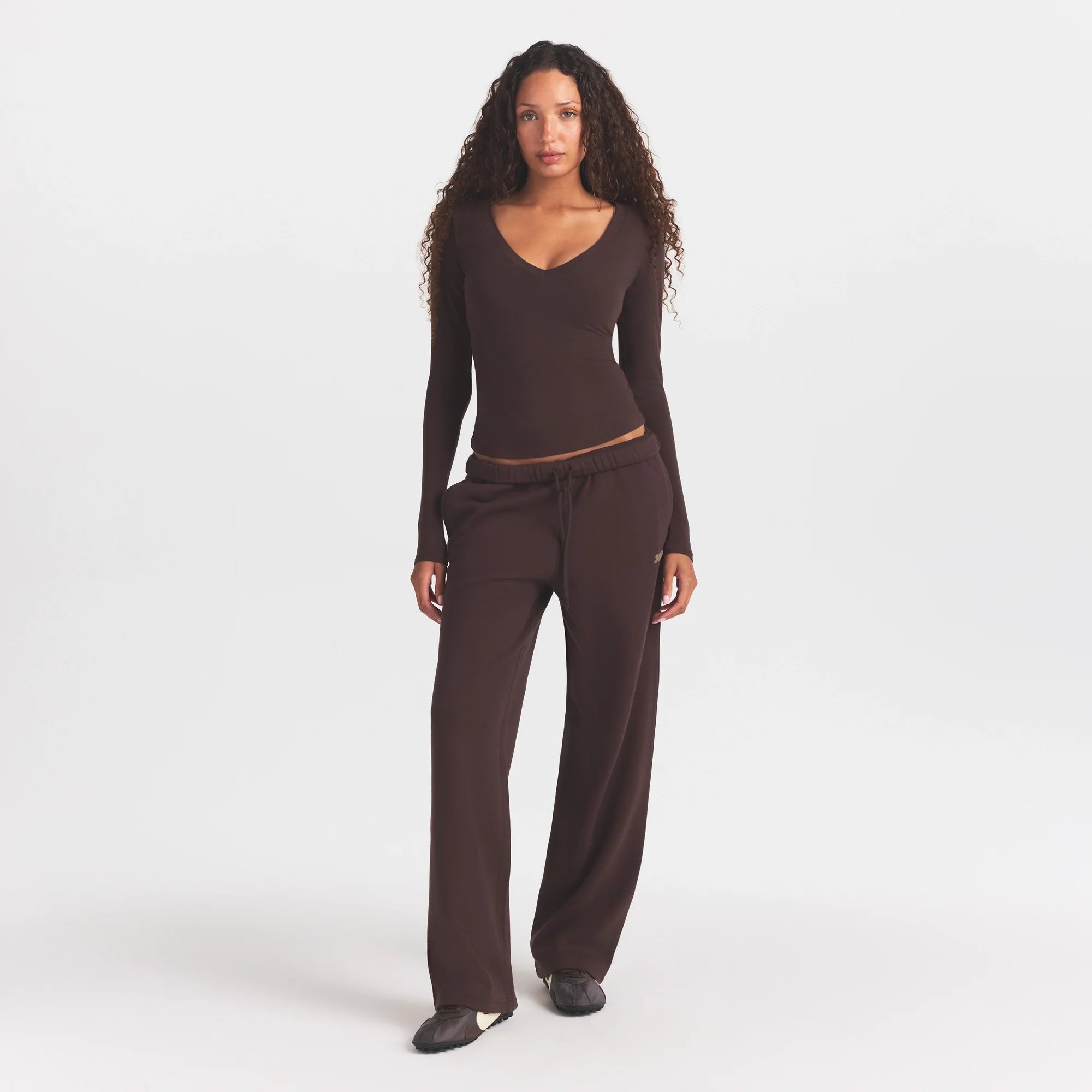 COTTON FLEECE STRAIGHT LEG PANT WITH EMBOSSED LOGO | ESPRESSO ON A MODEL FRONT VIEW @ | FOCUS: 0.0, 1.0, 0.9