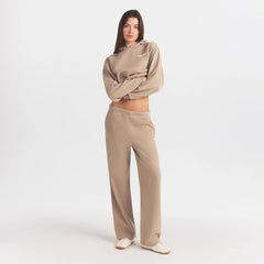 COTTON FLEECE STRAIGHT LEG PANT WITH EMBOSSED LOGO | LATTE ON A MODEL FRONT VIEW @ | FOCUS: 0.0, 1.0, 0.9