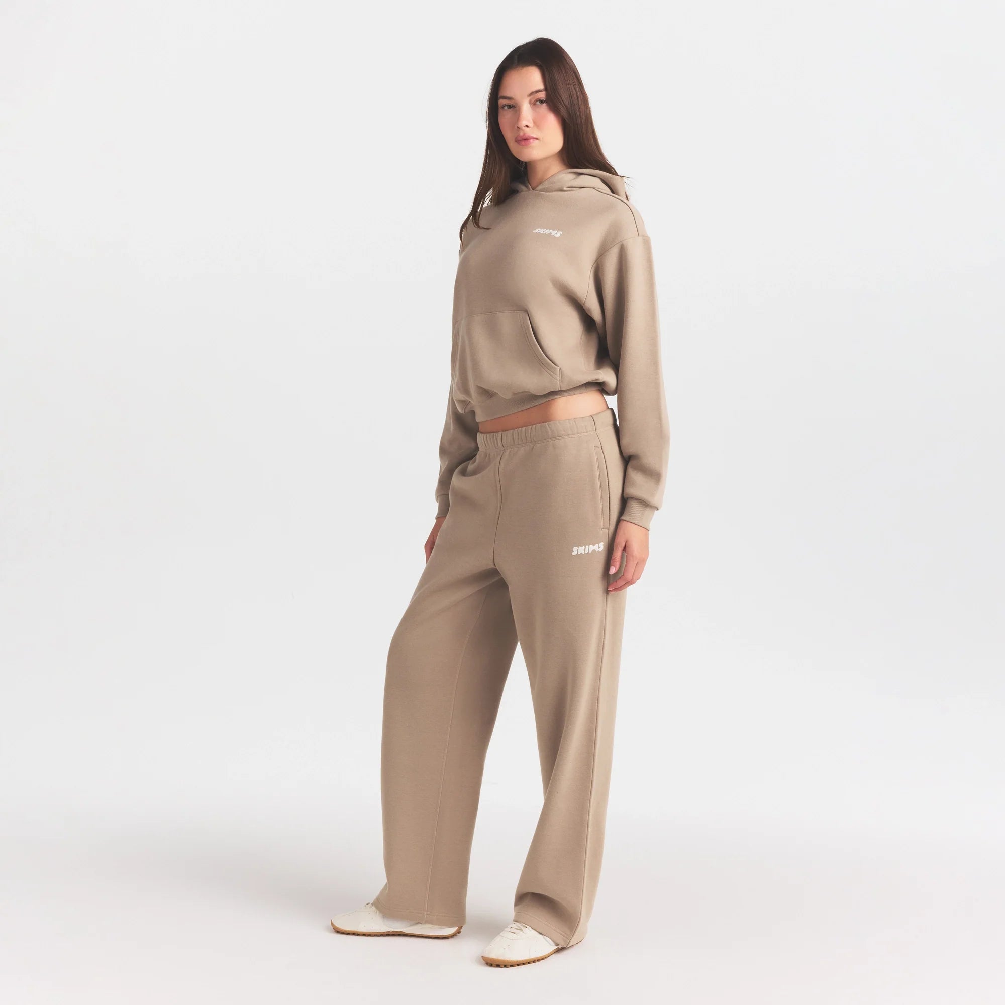 COTTON FLEECE STRAIGHT LEG PANT WITH EMBOSSED LOGO | LATTE ON A MODEL FRONT VIEW @ | FOCUS: 0.0, 1.0, 0.9