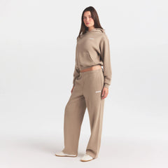 COTTON FLEECE STRAIGHT LEG PANT WITH EMBOSSED LOGO | LATTE ON A MODEL FRONT VIEW @ | FOCUS: 0.0, 1.0, 0.9