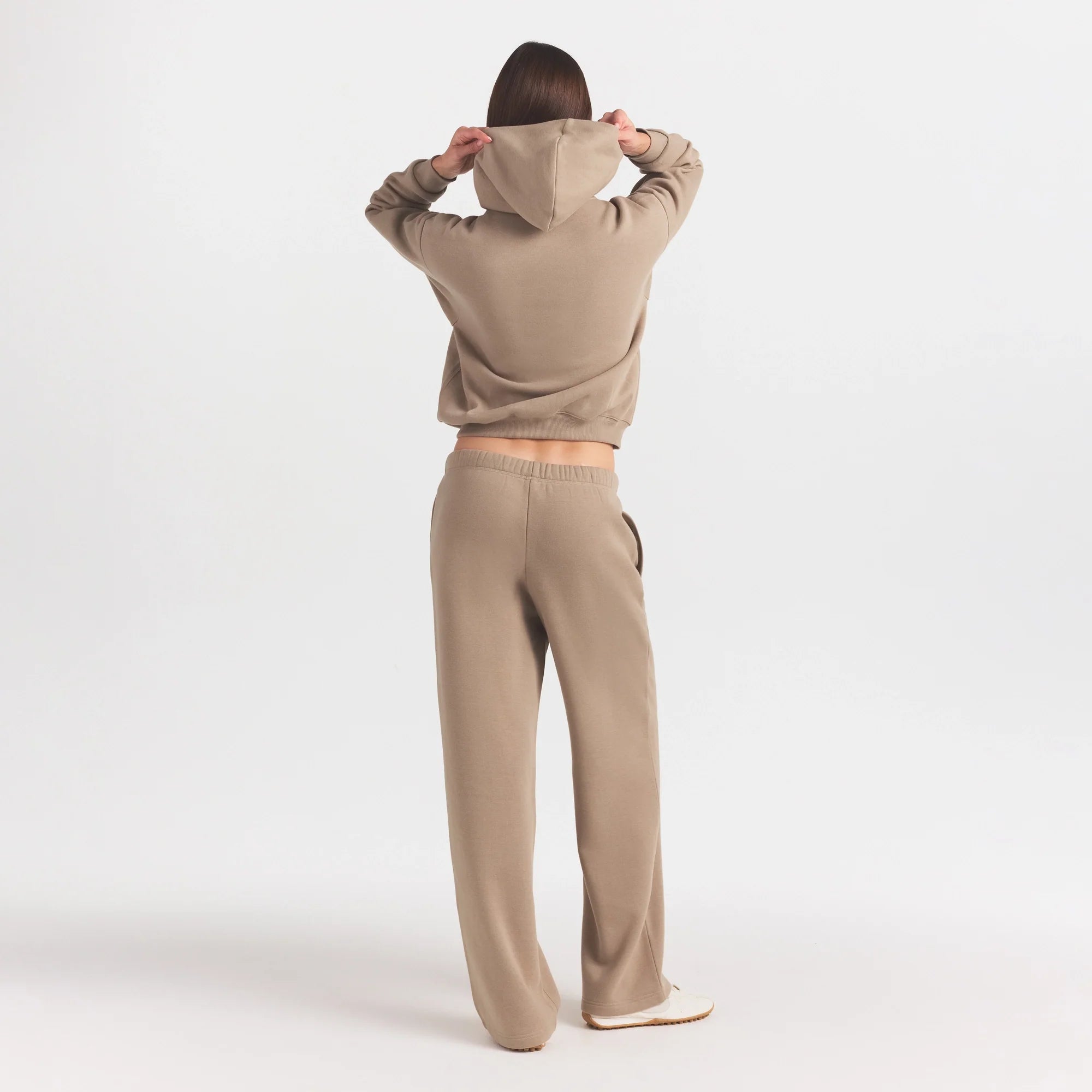 COTTON FLEECE STRAIGHT LEG PANT WITH EMBOSSED LOGO | LATTE ON A MODEL FRONT VIEW @ | FOCUS: 0.0, 1.0, 0.9