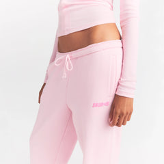 COTTON FLEECE JOGGER WITH EMBOSSED LOGO | CHERRY BLOSSOM ON A MODEL SIDE VIEW @ | FOCUS: 0.0, 1.0, 0.9