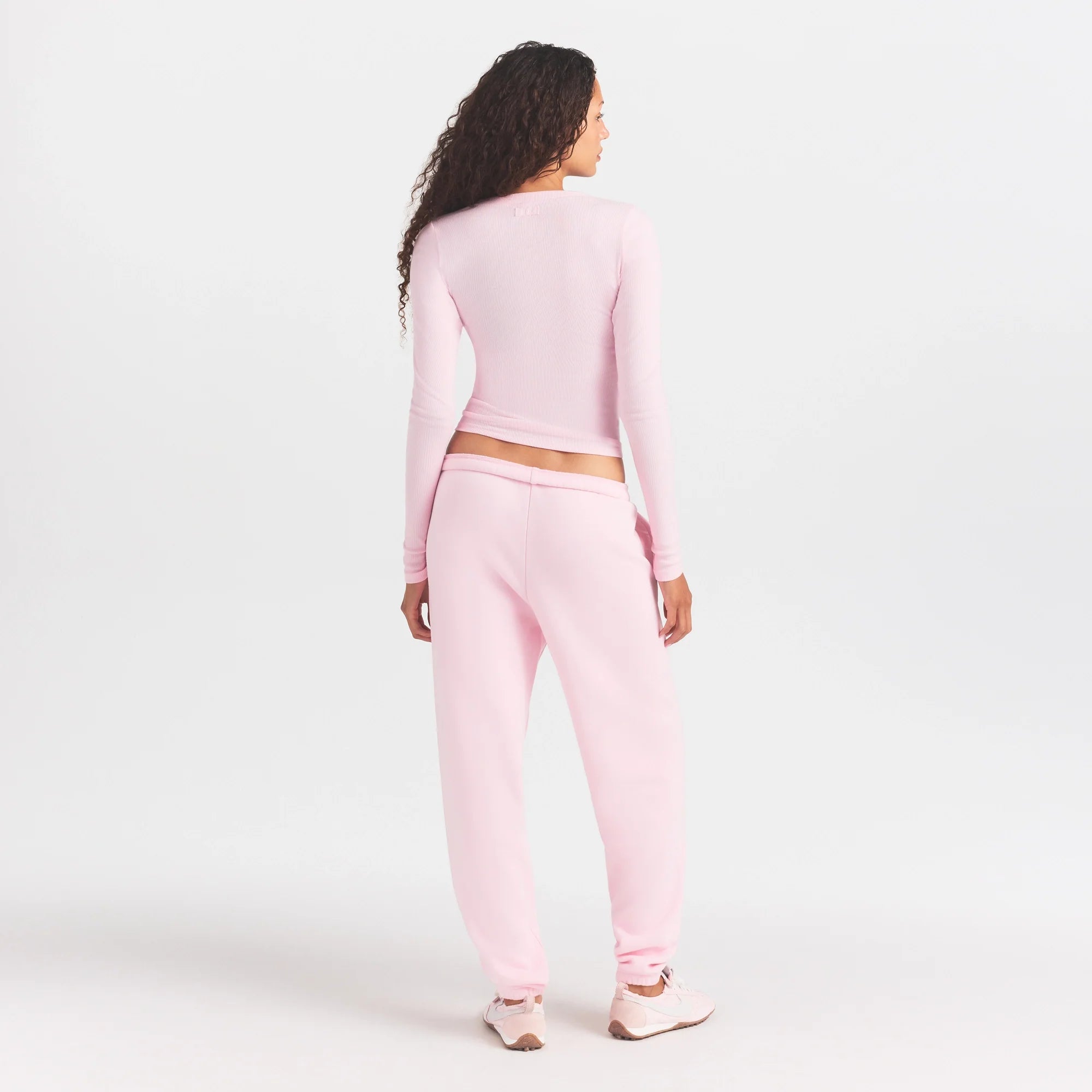 COTTON FLEECE JOGGER WITH EMBOSSED LOGO | CHERRY BLOSSOM ON A MODEL FRONT VIEW @ | FOCUS: 0.0, 1.0, 0.9