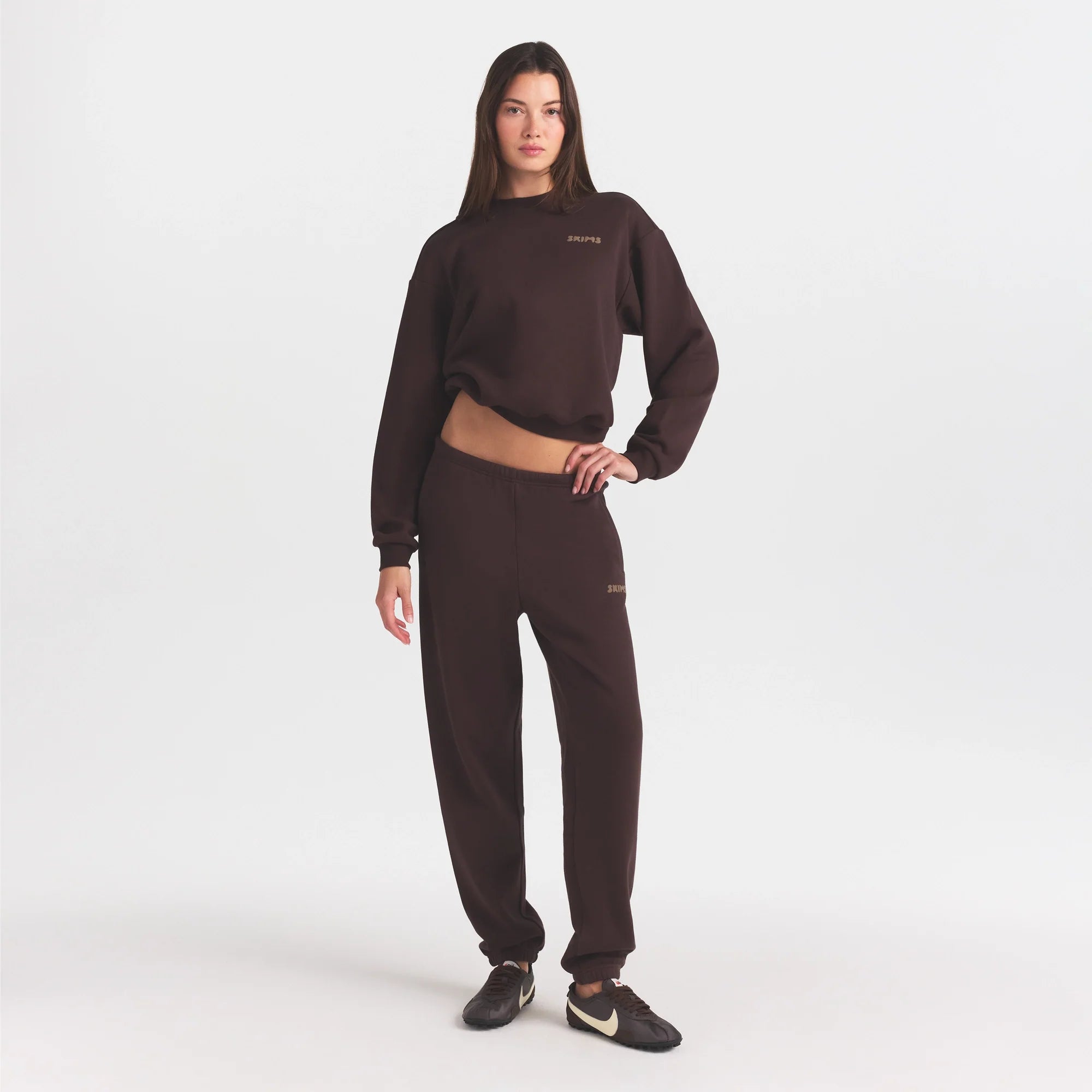 COTTON FLEECE JOGGER WITH EMBOSSED LOGO | ESPRESSO ON A MODEL FRONT VIEW @ | FOCUS: 0.0, 1.0, 0.9
