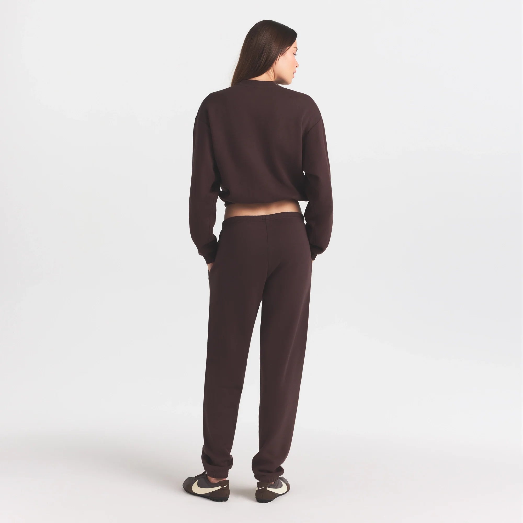 COTTON FLEECE JOGGER WITH EMBOSSED LOGO | ESPRESSO ON A MODEL FRONT VIEW @ | FOCUS: 0.0, 1.0, 0.9