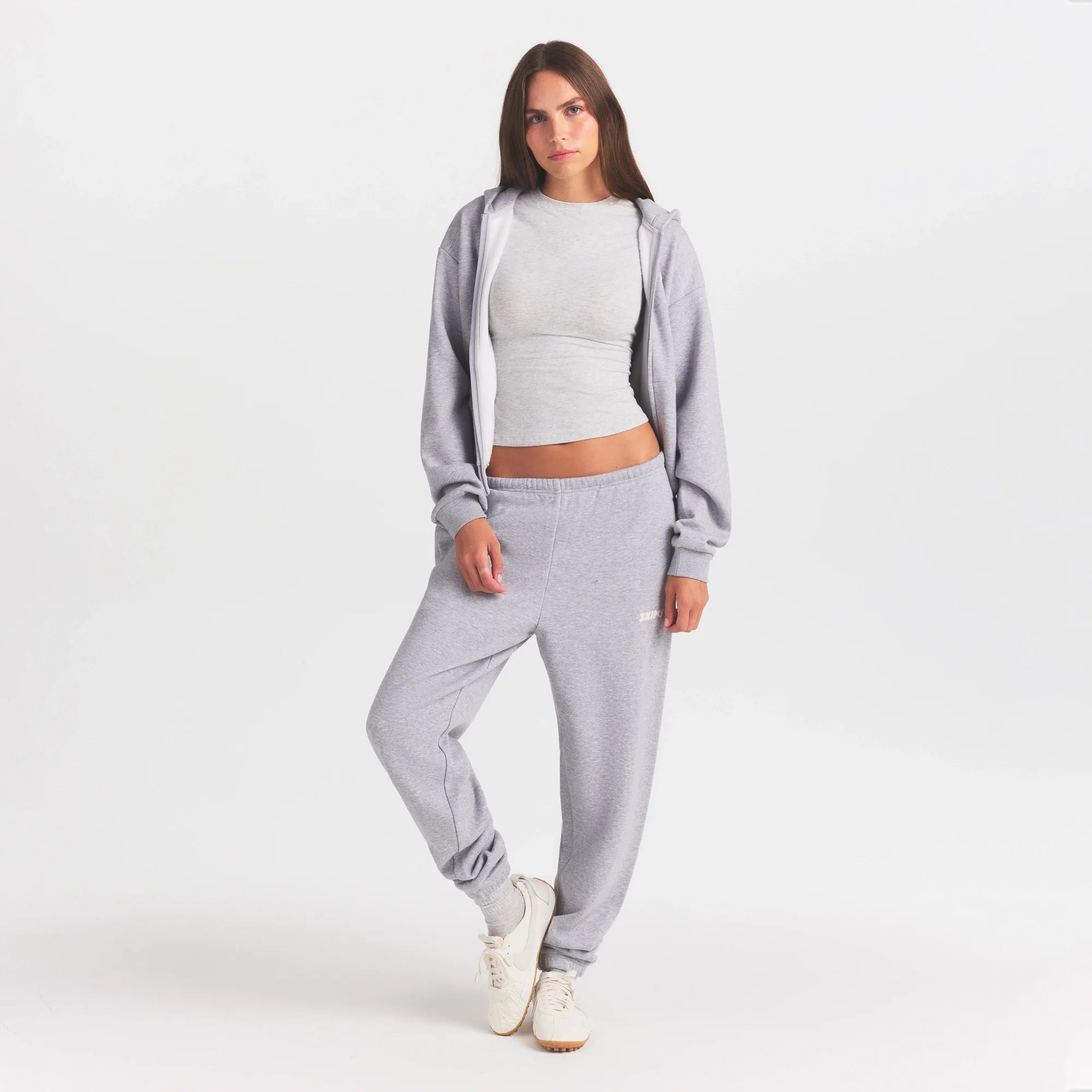 COTTON FLEECE JOGGER WITH EMBOSSED LOGO | HEATHER GREY ON A MODEL FRONT VIEW @ | FOCUS: 0.0, 1.0, 0.9