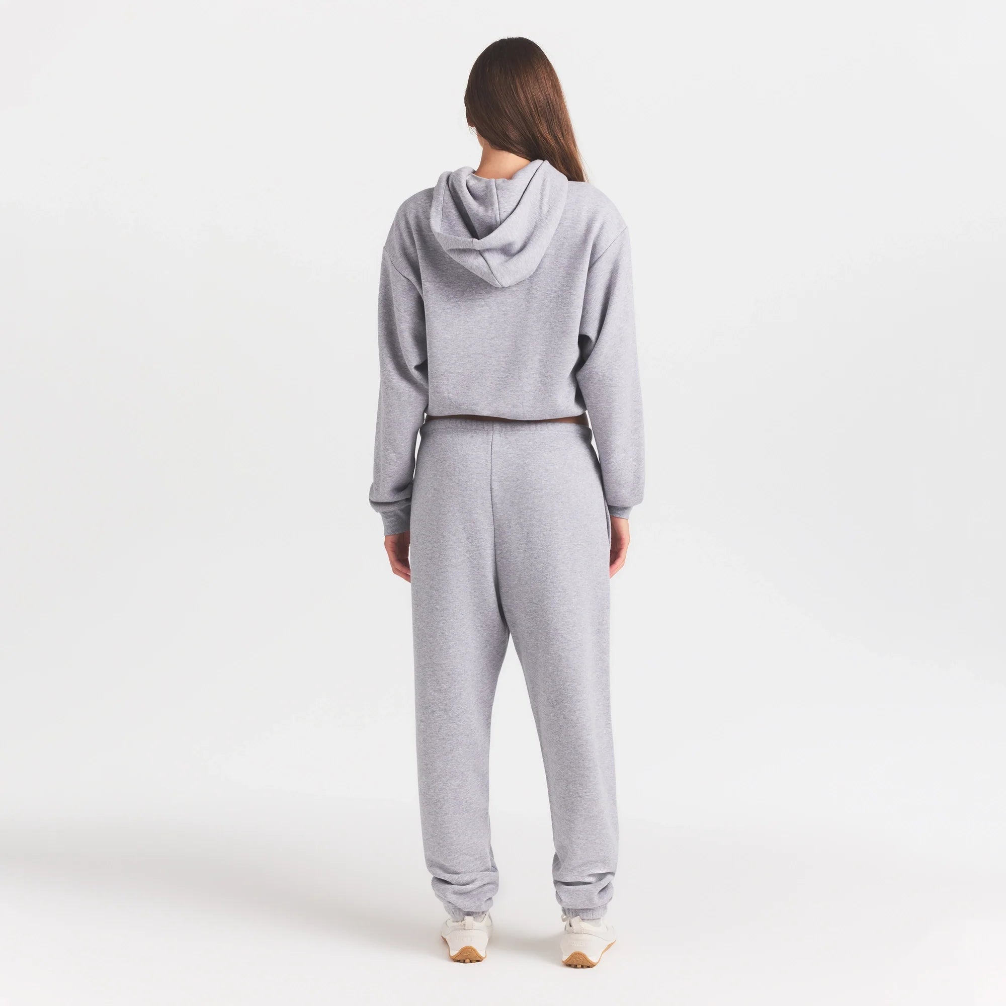 COTTON FLEECE JOGGER WITH EMBOSSED LOGO | HEATHER GREY ON A MODEL FRONT VIEW @ | FOCUS: 0.0, 1.0, 0.9