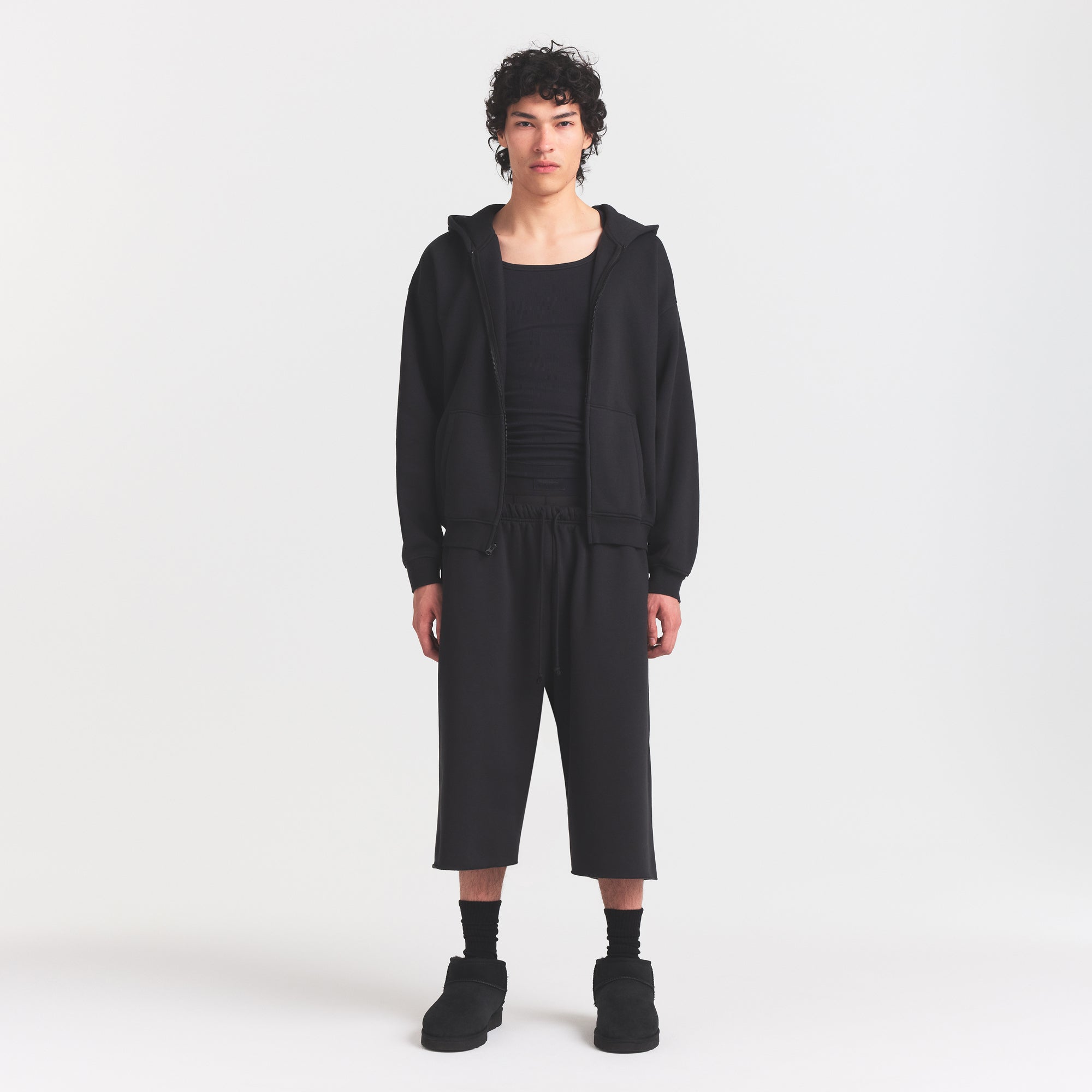 FLEECE LOUNGE MENS RELAXED LONG SHORT | WASHED ONYX ON A MODEL FRONT VIEW @ | FOCUS: 0.0, 1.0, 0.9