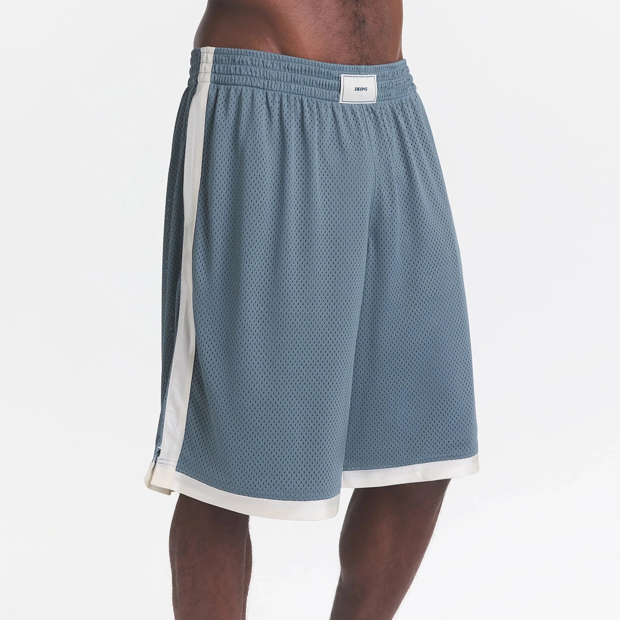 MESH APPAREL MENS LONG SHORT | ZIRCON ON A MODEL SIDE VIEW @ | FOCUS: 0.0, 1.0, 0.9