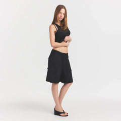 WOVEN COTTON OVERSIZED CARGO SHORT | ONYX ON A MODEL FRONT VIEW @ | FOCUS: 0.0, 1.0, 0.9
