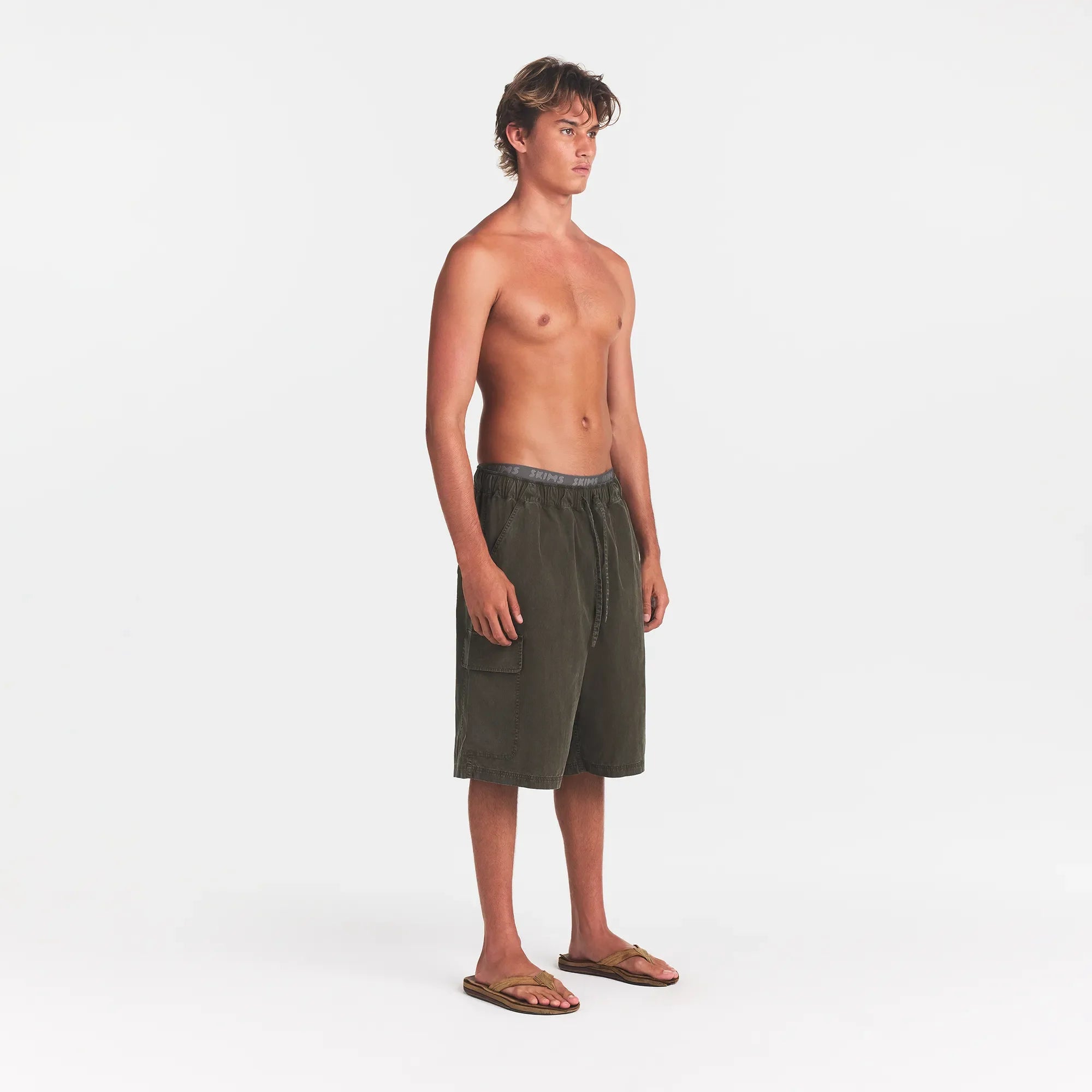 WOVEN MENS RELAXED CARGO SHORT | JUNGLE ON A MODEL SIDE VIEW @ | FOCUS: 0.0, 1.0, 0.9