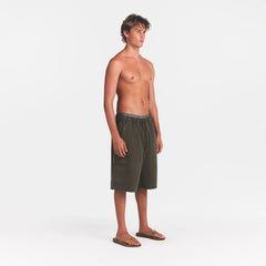WOVEN MENS RELAXED CARGO SHORT | JUNGLE ON A MODEL SIDE VIEW @ | FOCUS: 0.0, 1.0, 0.9