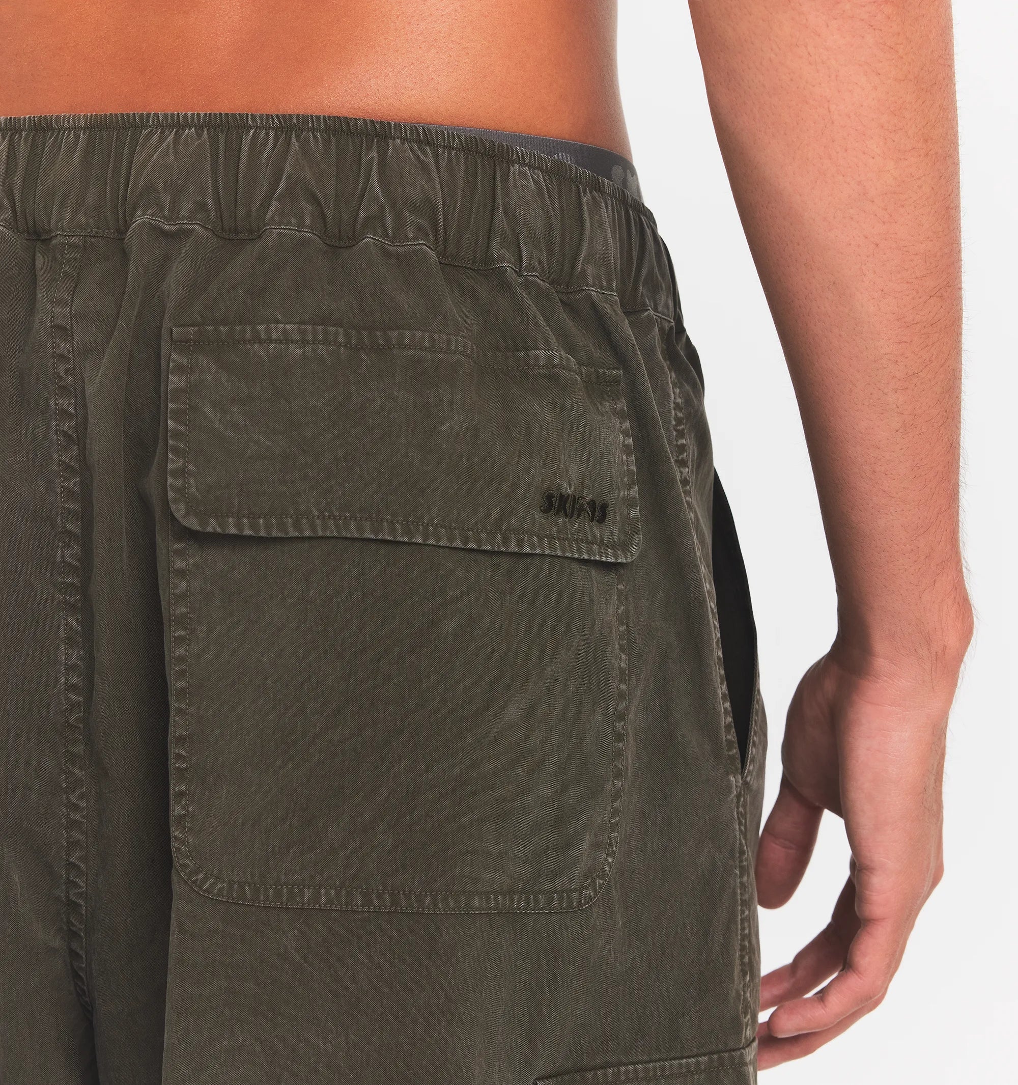 WOVEN MENS RELAXED CARGO SHORT | JUNGLE ON A MODEL BACK VIEW @ | FOCUS: 0.0, 1.0, 0.9