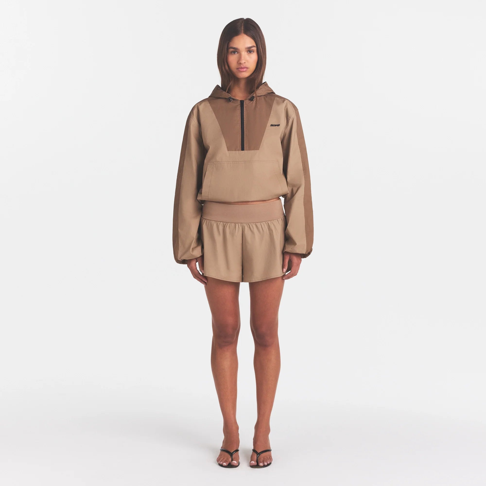 WOVEN COTTON FLUTTER SHORT | DESERT ON A MODEL FRONT VIEW @ | FOCUS: 0.0, 1.0, 0.9