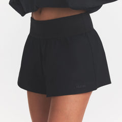 WOVEN COTTON FLUTTER SHORT | ONYX ON A MODEL SIDE VIEW @ | FOCUS: 0.0, 1.0, 0.9