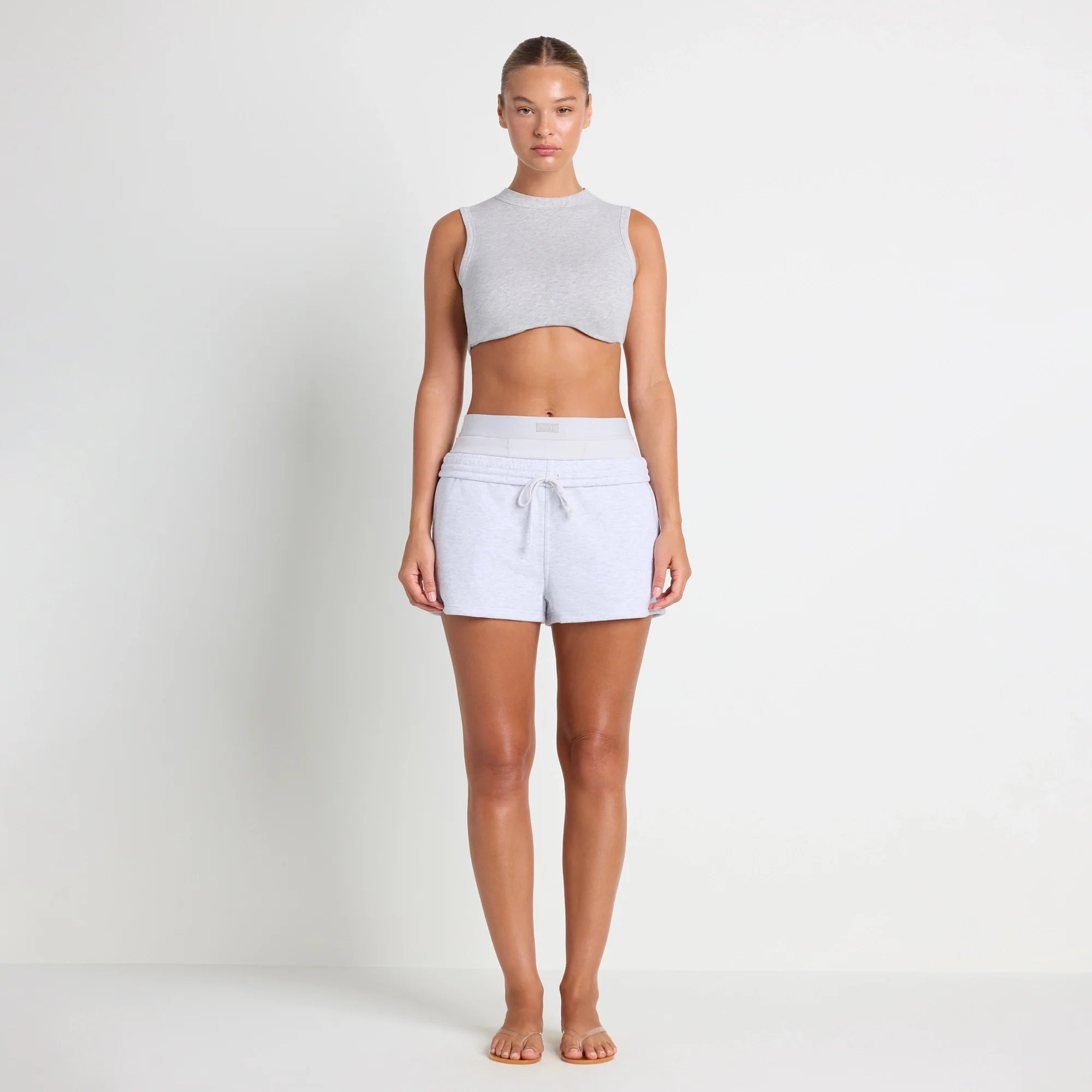 COTTON FLEECE DOUBLE WAISTBAND SHORT | LIGHT HEATHER GREY ON A MODEL FRONT VIEW@| FOCUS: 0.0, 1.0, 0.9