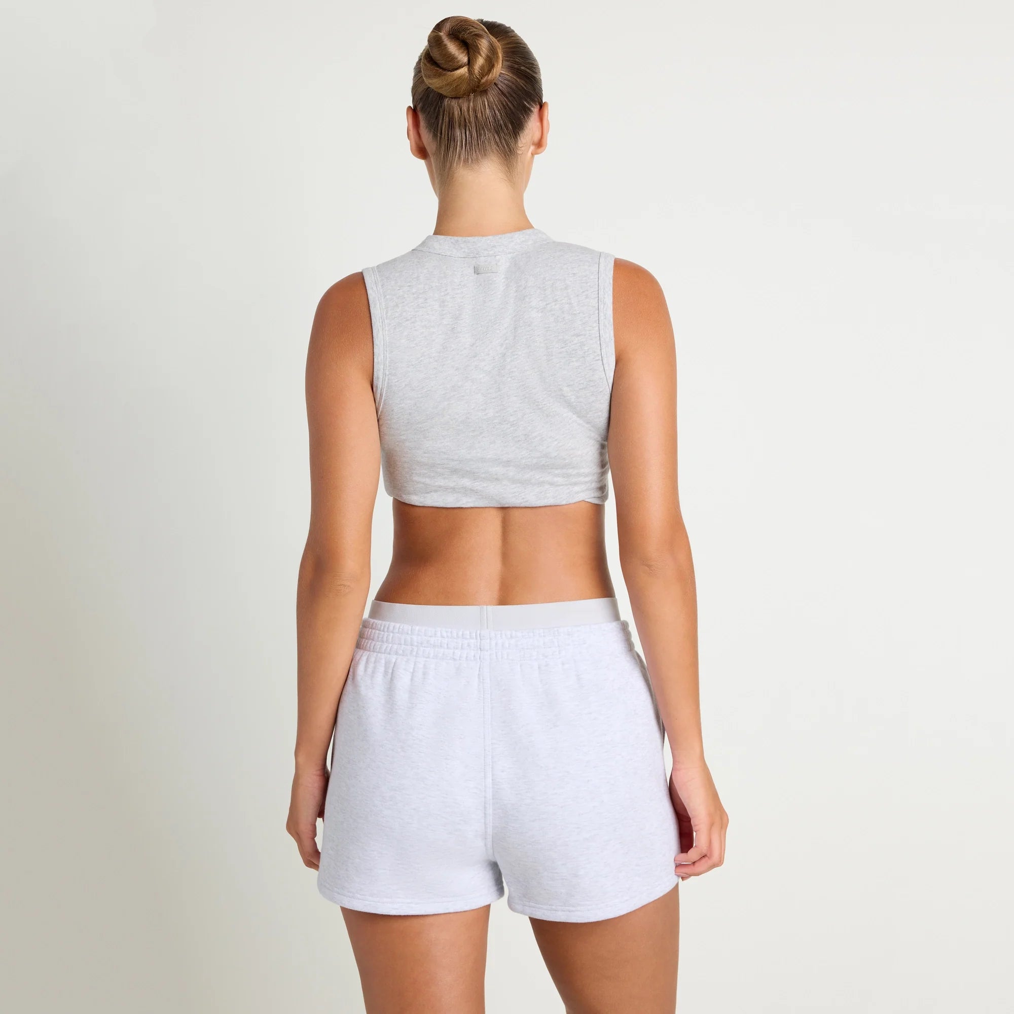 COTTON FLEECE DOUBLE WAISTBAND SHORT | LIGHT HEATHER GREY ON A MODEL SIDE VIEW@| FOCUS: 0.0, 1.0, 0.9
