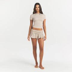 COTTON JERSEY FOLDOVER MINI SKORT | STONE ON A MODEL FRONT VIEW @ | FOCUS: 0.0, 1.0, 0.9