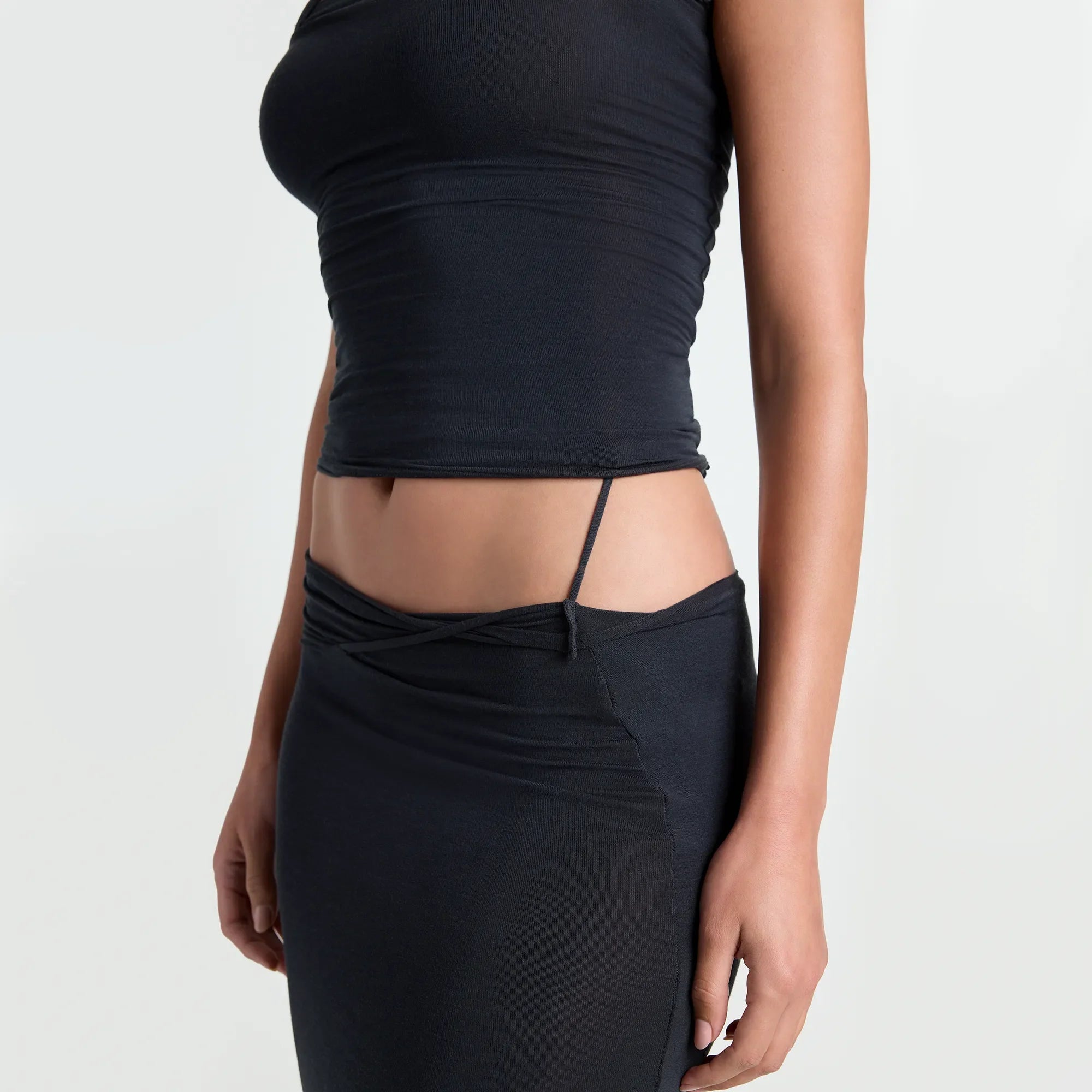 VETTESE X SKIMS SHEER MODAL MIDI SKIRT | ONYX ON A MODEL SIDE VIEW | FOCUS: 0.0, 1.0, 0.9