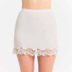RIB KNIT LACE MINI SKIRT | EGRET ON A MODEL SIDE VIEW @ | FOCUS: 0.0, 1.0, 0.9
