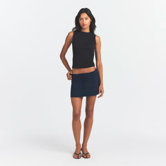 DRAPEY FRENCH TERRY MINI SKIRT | NAVY ON A MODEL FRONT VIEW @ | FOCUS: 0.0, 1.0, 0.9