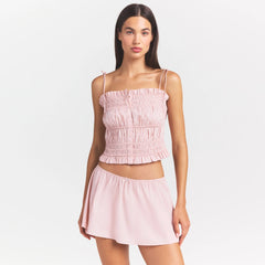 COTTON POPLIN MINI SKIRT | DUSTY PINK ON A MODEL SIDE VIEW @ | FOCUS: 0.0, 1.0, 0.9
