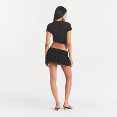 SHEER KNIT RUFFLE MINI SKIRT | ONYX ON A MODEL BACK VIEW @ | FOCUS: 0.0, 1.0, 0.9