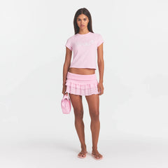 SHEER KNIT RUFFLE MINI SKIRT | PEONY ON A MODEL FRONT VIEW @ | FOCUS: 0.0, 1.0, 0.9