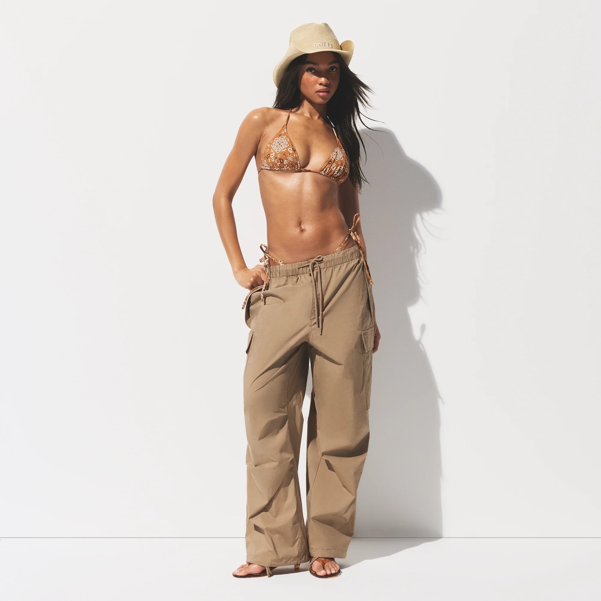 SIGNATURE SWIM TRIANGLE BIKINI TOP | ALMOND BANDANA ON A MODEL FRONT VIEW 