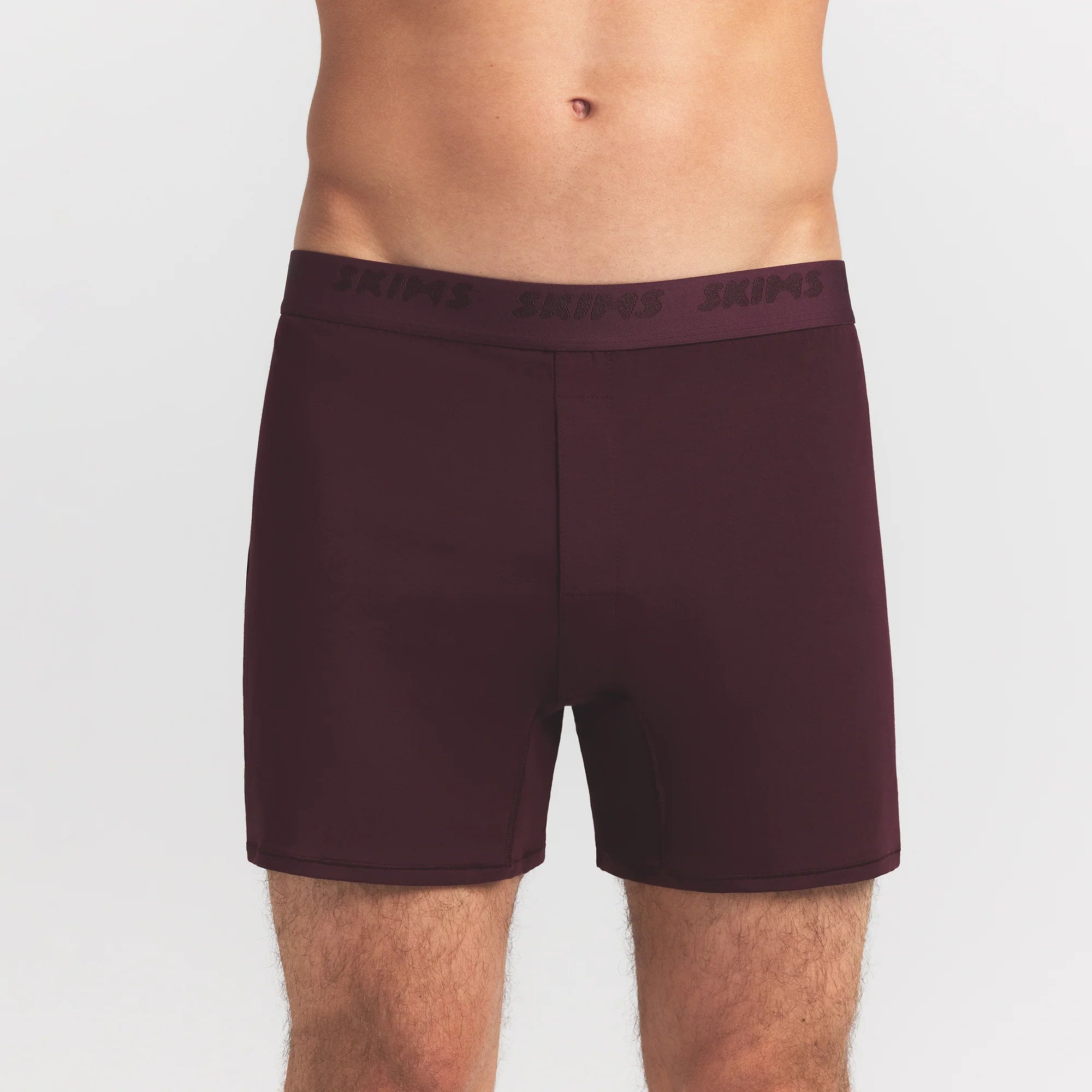 SKIMS STRETCH MENS KNIT BOXER | CURRANT ON A MODEL FRONT VIEW @ | FOCUS: 0.0, 1.0, 0.9