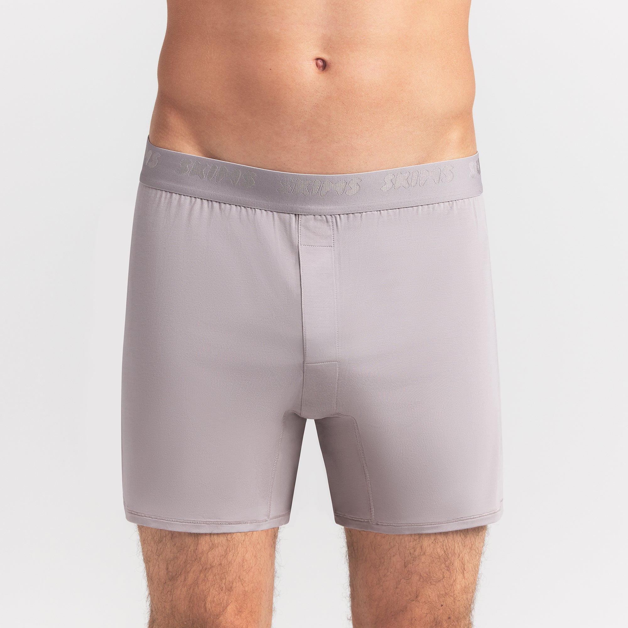 SKIMS STRETCH MENS KNIT BOXER | OYSTER ON A MODEL FRONT VIEW @ | FOCUS: 0.0, 1.0, 0.9