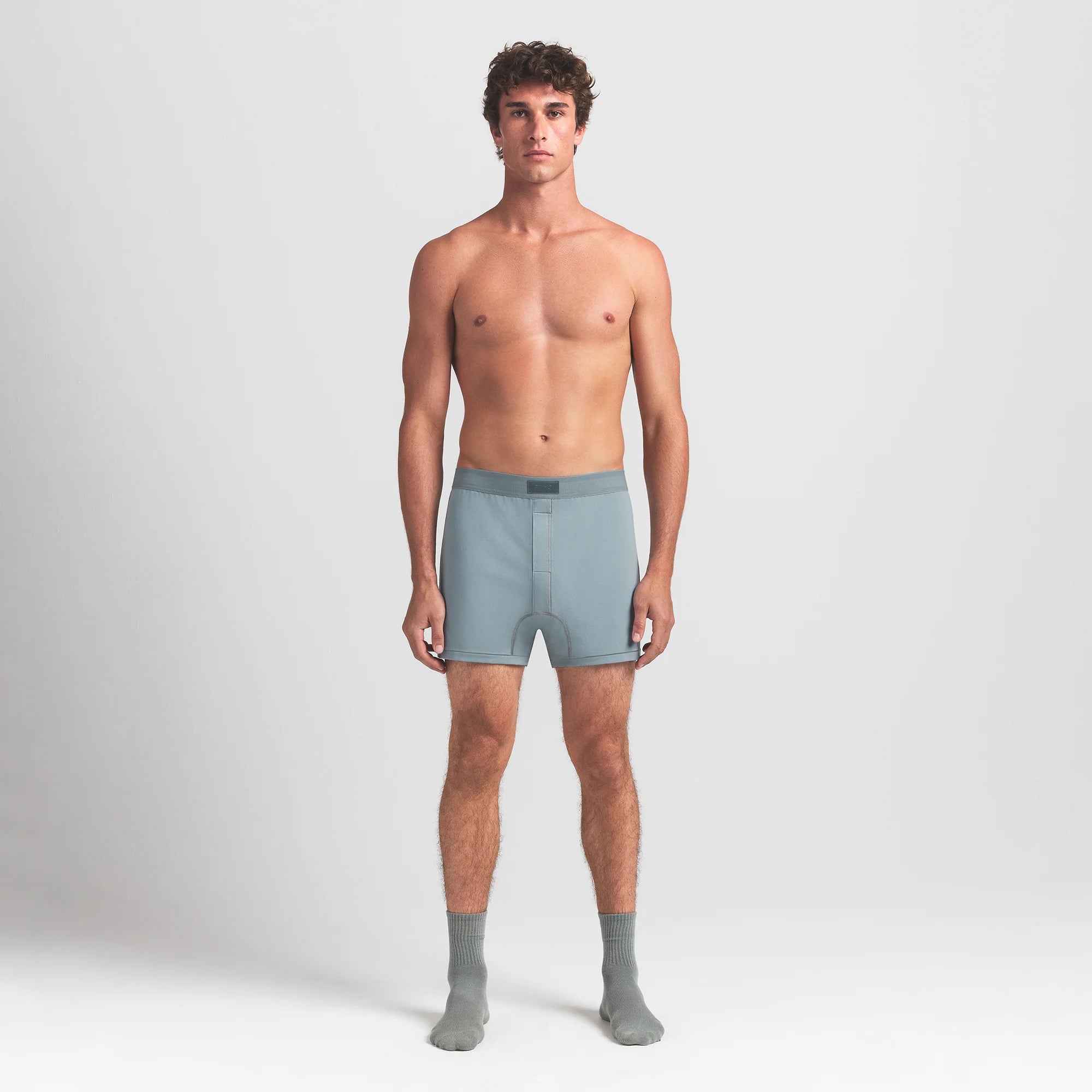 SKIMS COTTON MENS KNIT BOXER | SKY ON A MODEL FRONT VIEW @ | FOCUS: 0.0, 1.0, 0.9