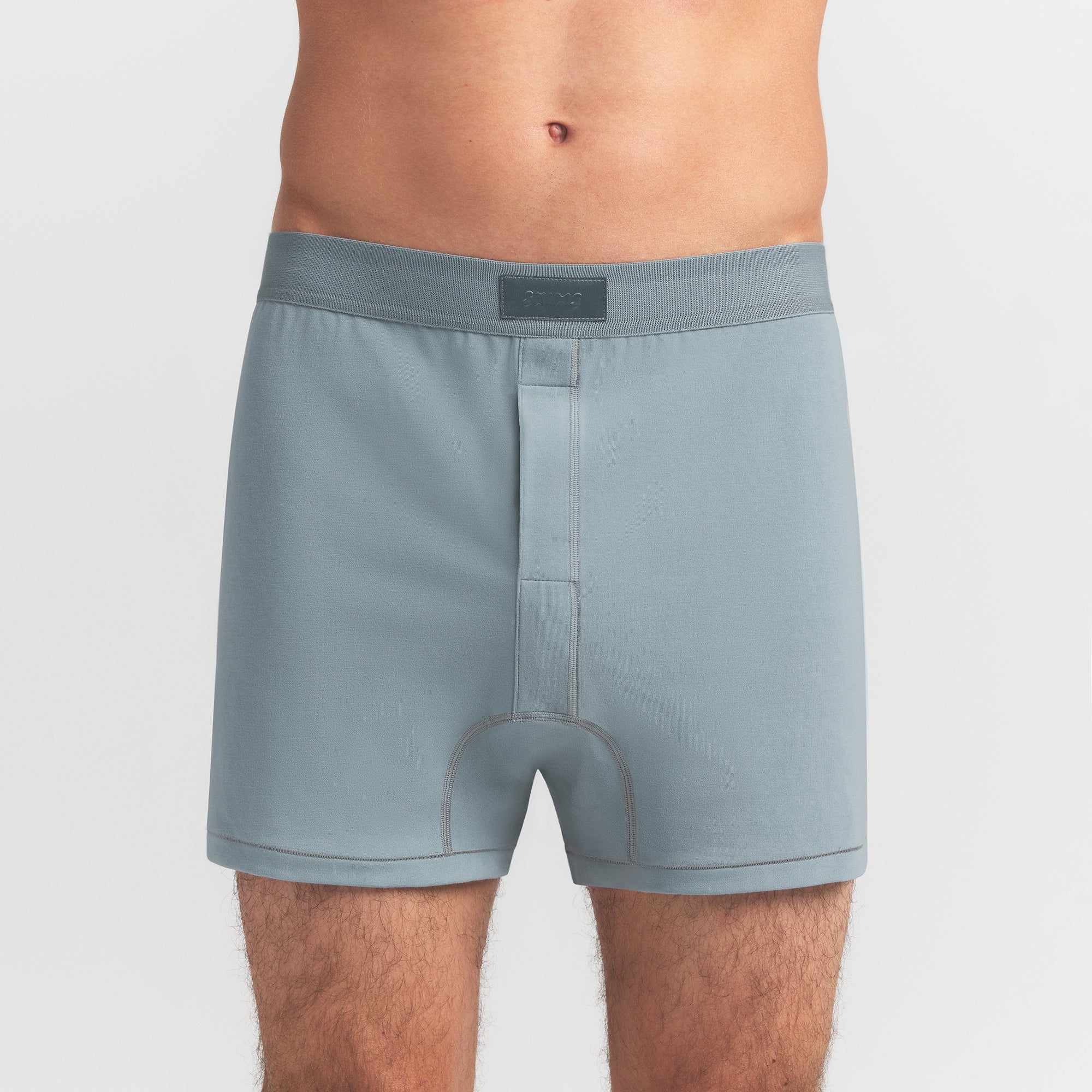 SKIMS COTTON MENS KNIT BOXER | SKY ON A MODEL FRONT VIEW @ | FOCUS: 0.0, 1.0, 0.9