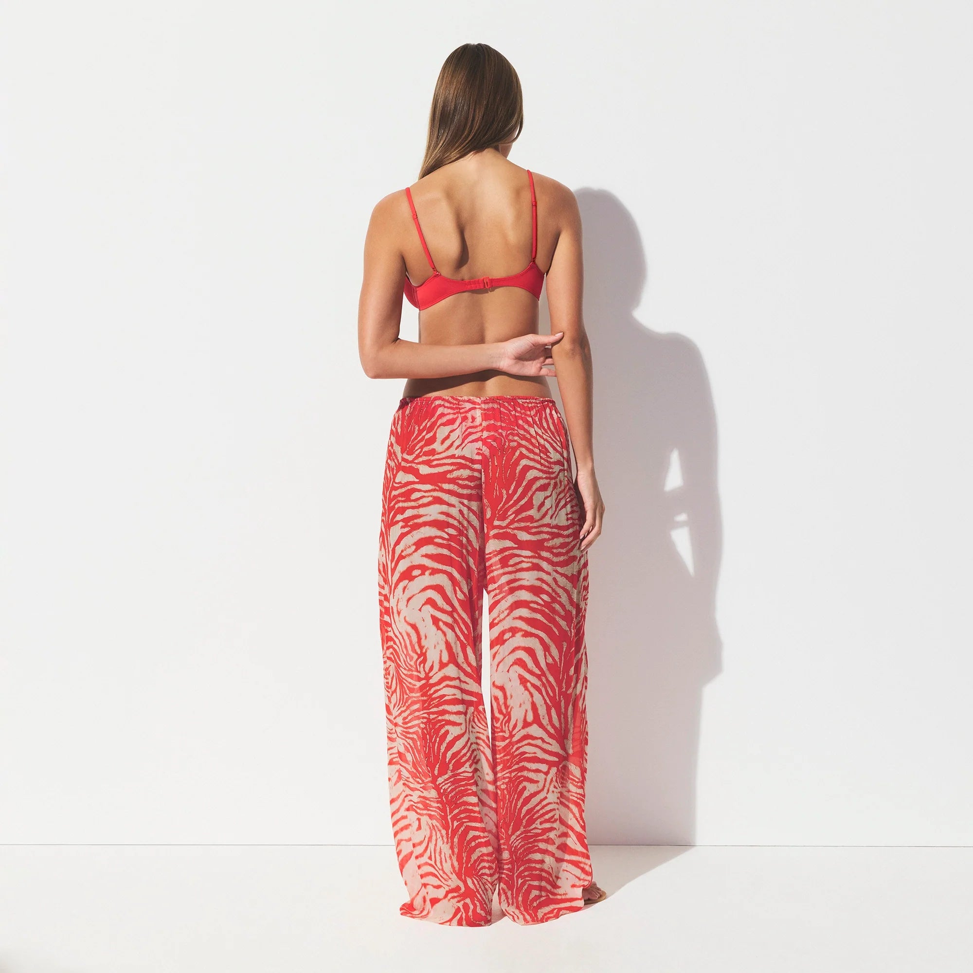 SHEER COVER-UPS PANT | CARMINE ZEBRA PRINT ON A MODEL SIDE VIEW @ | FOCUS: 0.0, 1.0, 0.9 