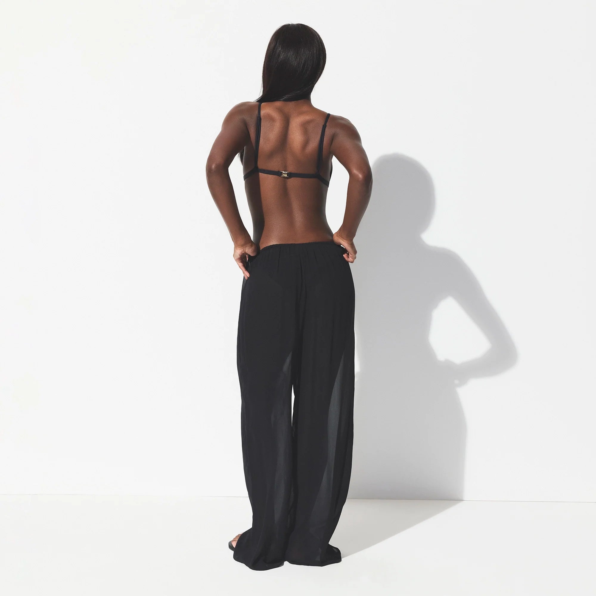 SHEER COVER-UPS PANT | OBSIDIAN ON A MODEL SIDE VIEW @ | FOCUS: 0.0, 1.0, 0.9 