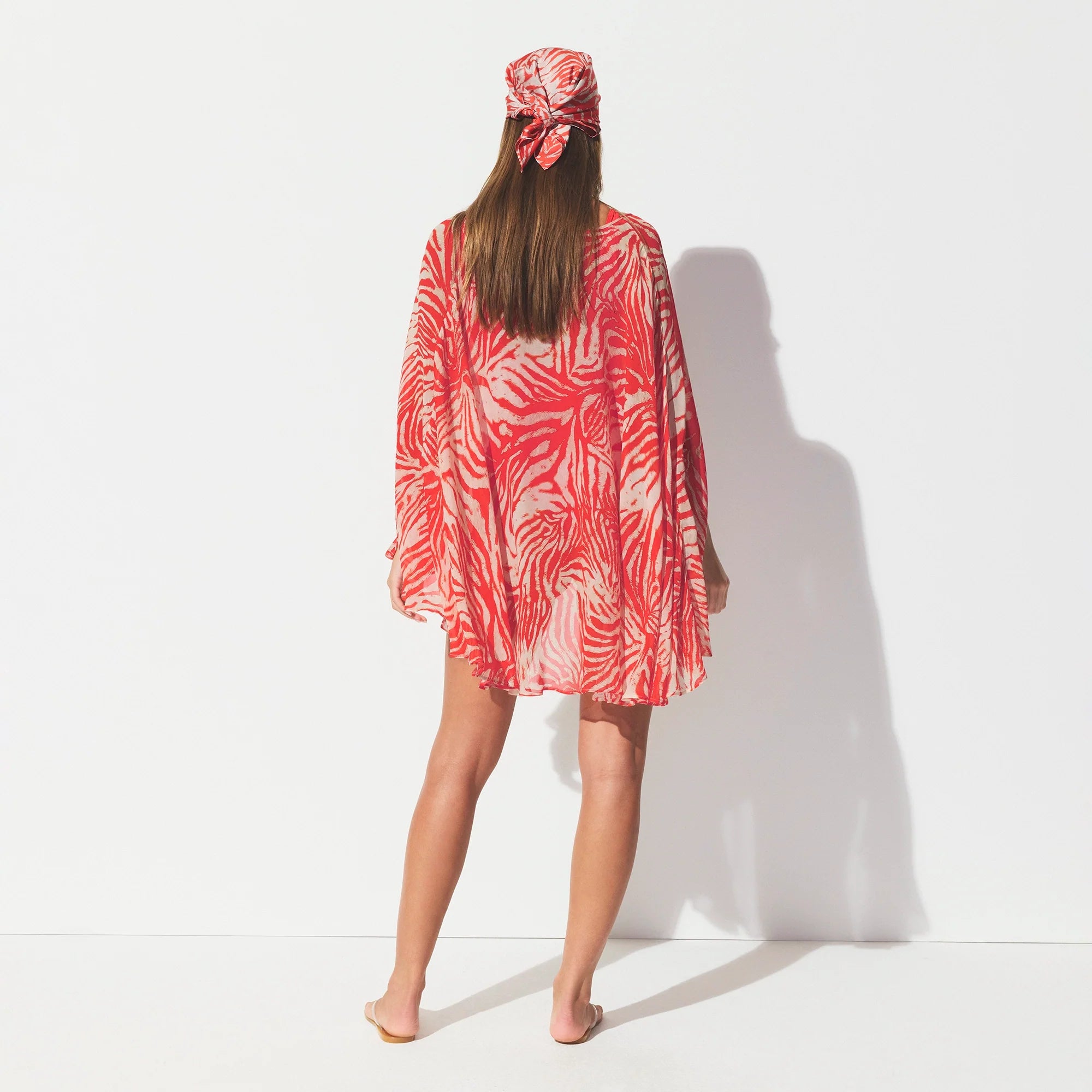 SHEER COVER-UPS SHORT KAFTAN | CARMINE ZEBRA PRINT ON A MODEL SIDE VIEW @ | FOCUS: 0.0, 1.0, 0.9 