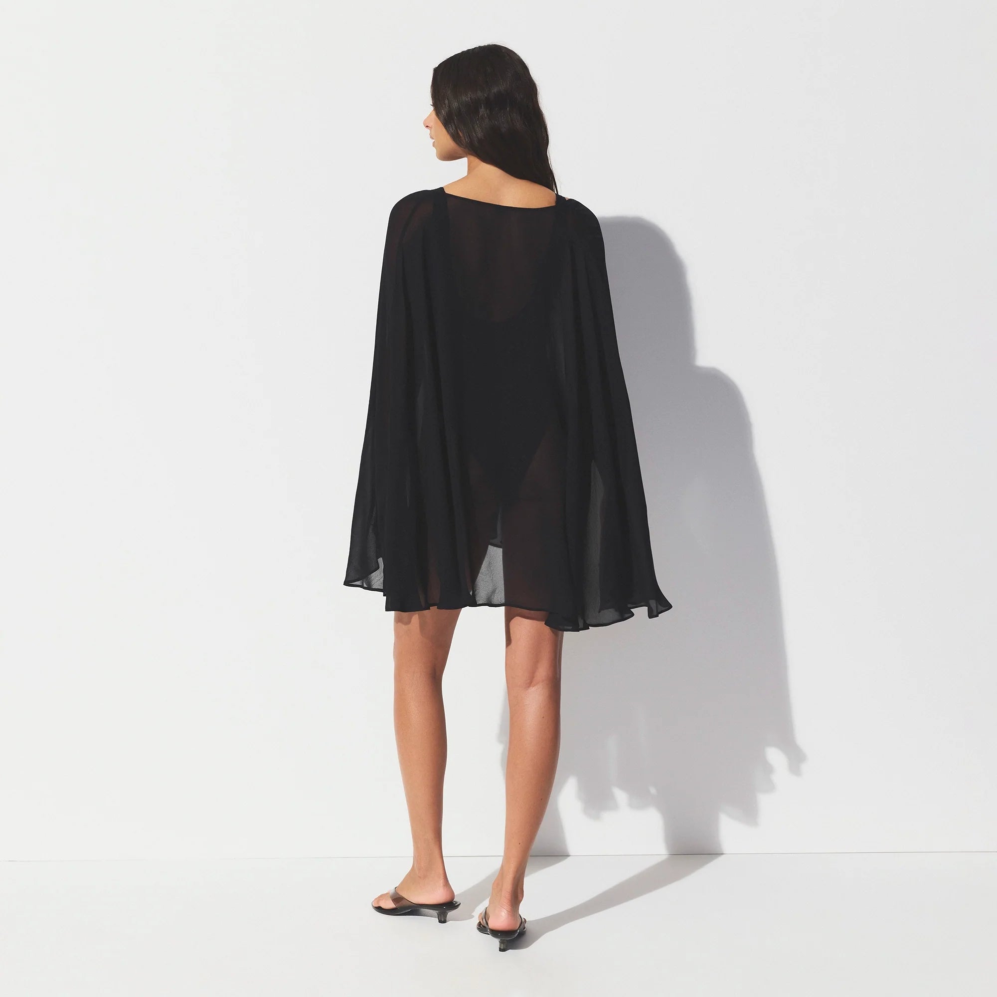SHEER COVER-UPS SHORT KAFTAN | OBSIDIAN ON A MODEL SIDE VIEW @ | FOCUS: 0.0, 1.0, 0.9 