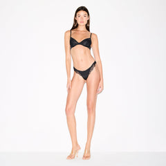SKIMS LACE UNLINED DEMI BRA | ONYX ON A MODEL FRONT VIEW @ | FOCUS: 0.0, 1.0, 0.9