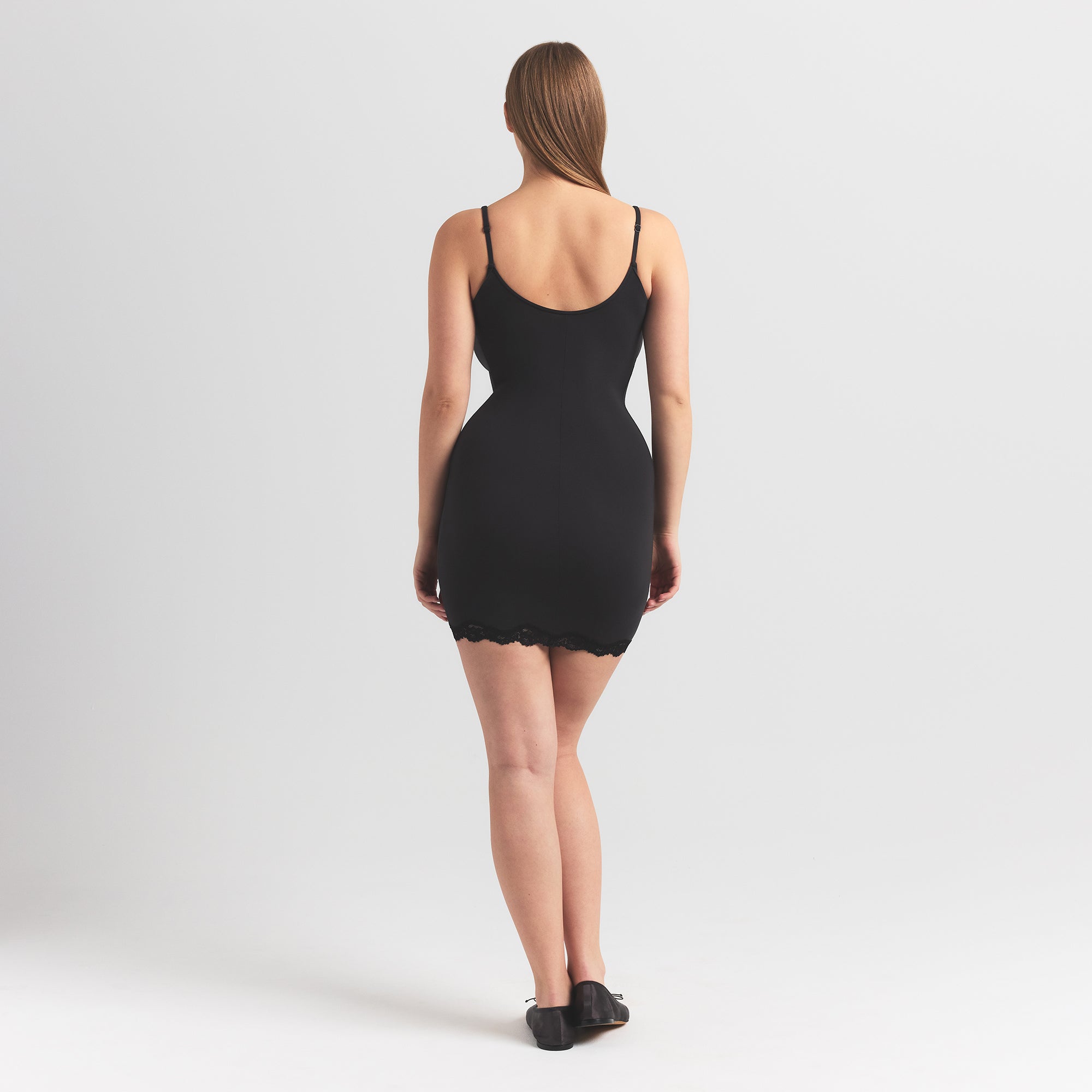 FITS EVERYBODY LACE SLIP DRESS | ONYX ON A MODEL BACK VIEW @ | FOCUS: 0.0, 1.0, 0.9