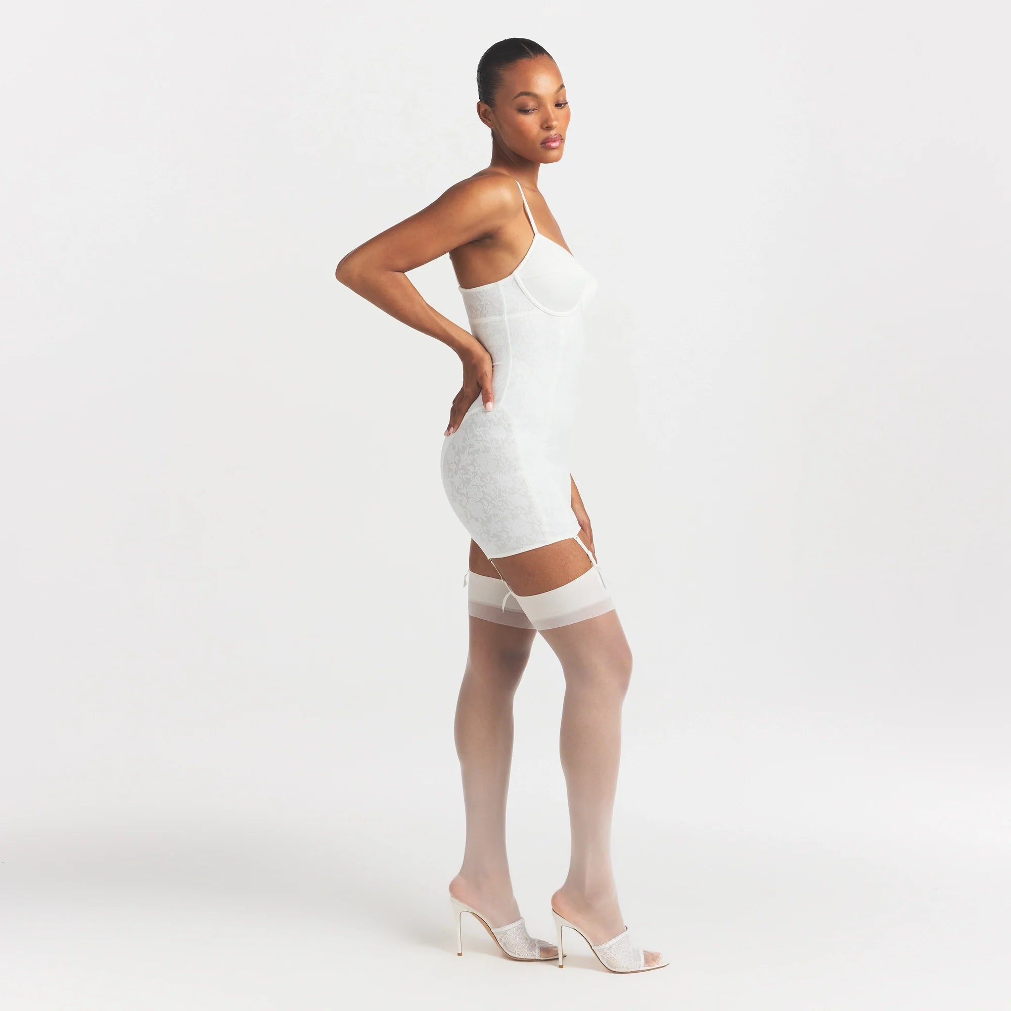 LACE SHAPEWEAR MINI SLIP DRESS | IVORY ON A MODEL FRONT VIEW @