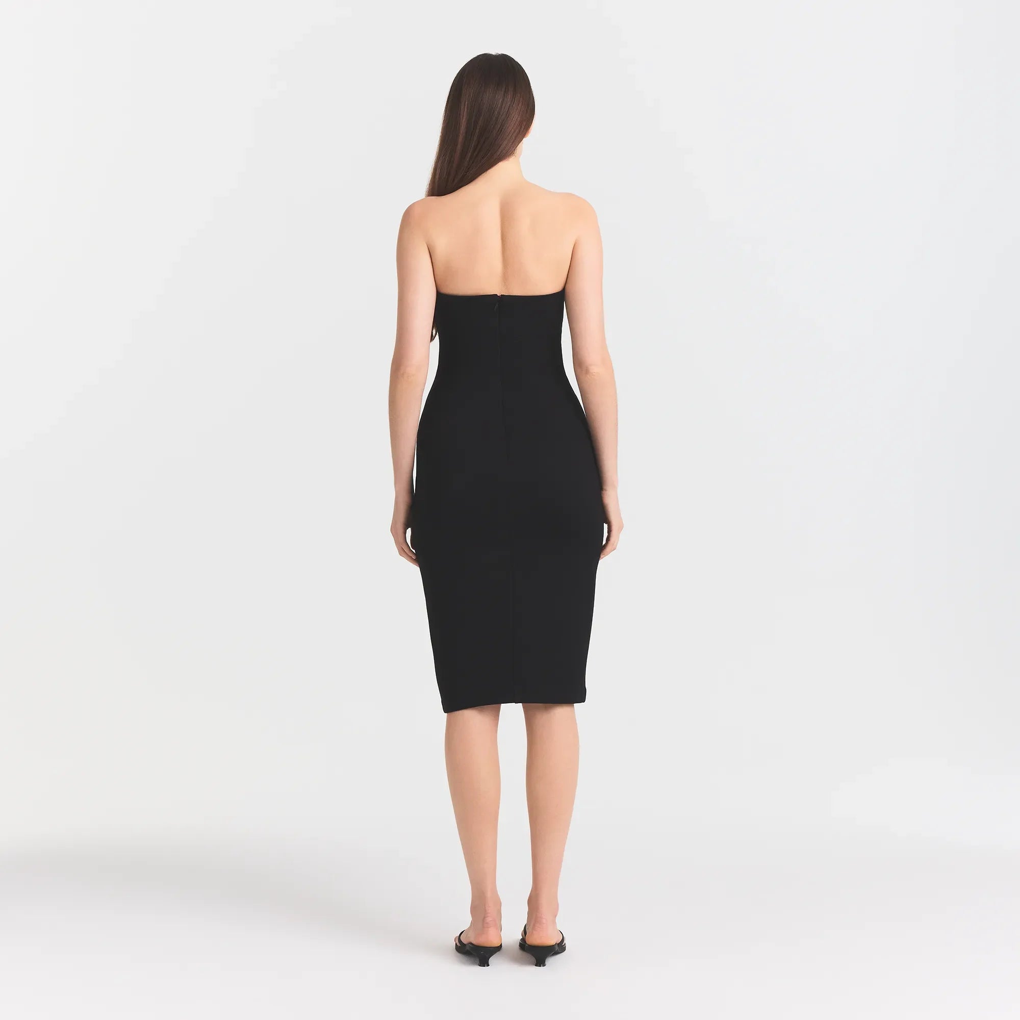 THE ESSENTIAL COLLECTION STRAPLESS MIDI DRESS | OBSIDIAN ON A MODEL BACK VIEW @ | FOCUS: 0.0, 1.0, 0.9