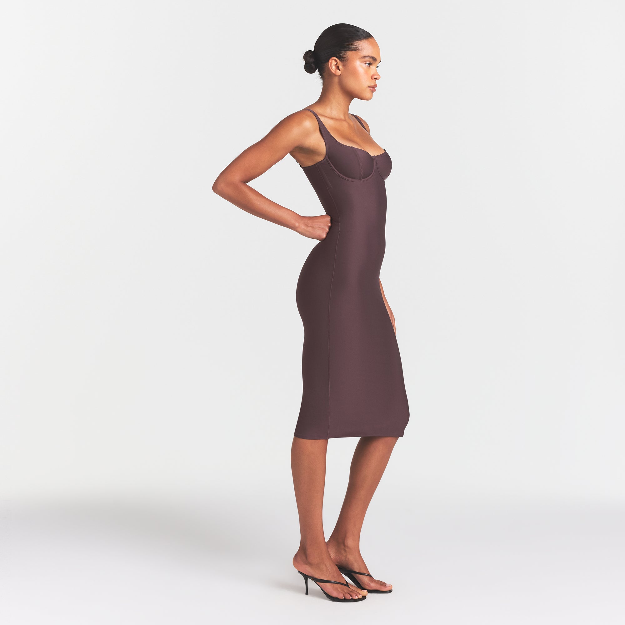 SKIMS BODY MIDI DRESS | RAISIN ON A MODEL FRONT VIEW @