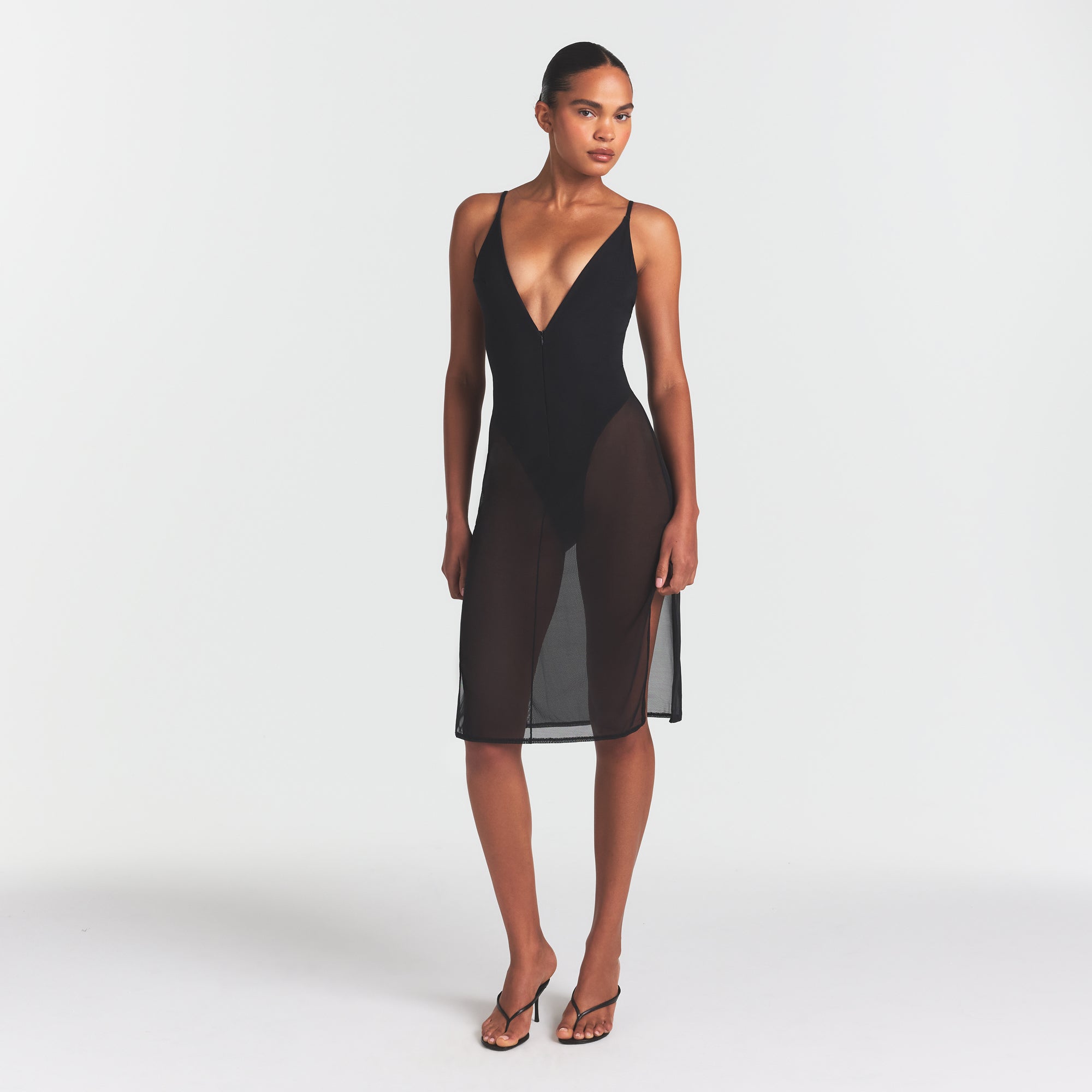 SKIMS BODY MESH PLUNGE MIDI DRESS | ONYX ON A MODEL FRONT VIEW @