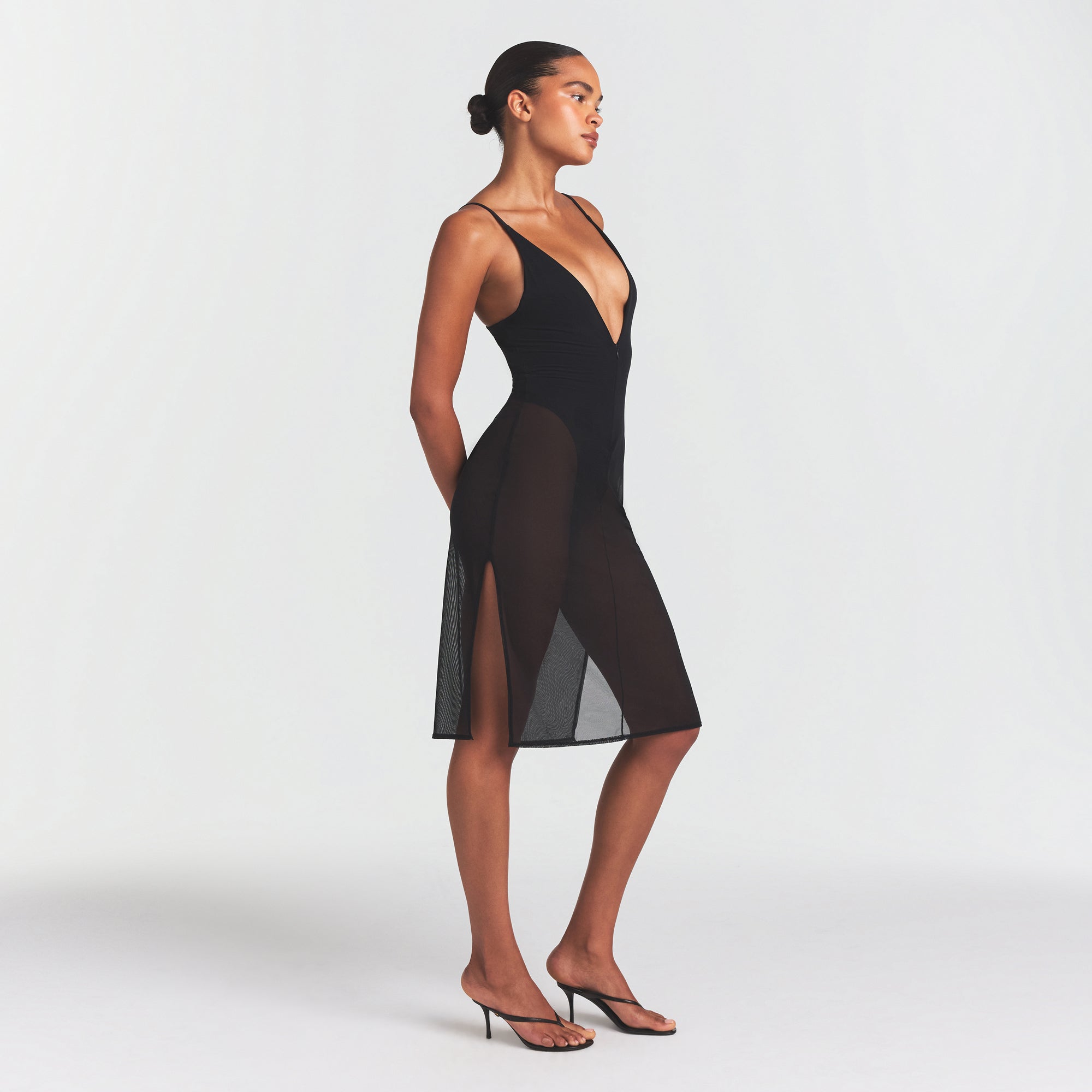 SKIMS BODY MESH PLUNGE MIDI DRESS | ONYX ON A MODEL FRONT VIEW @