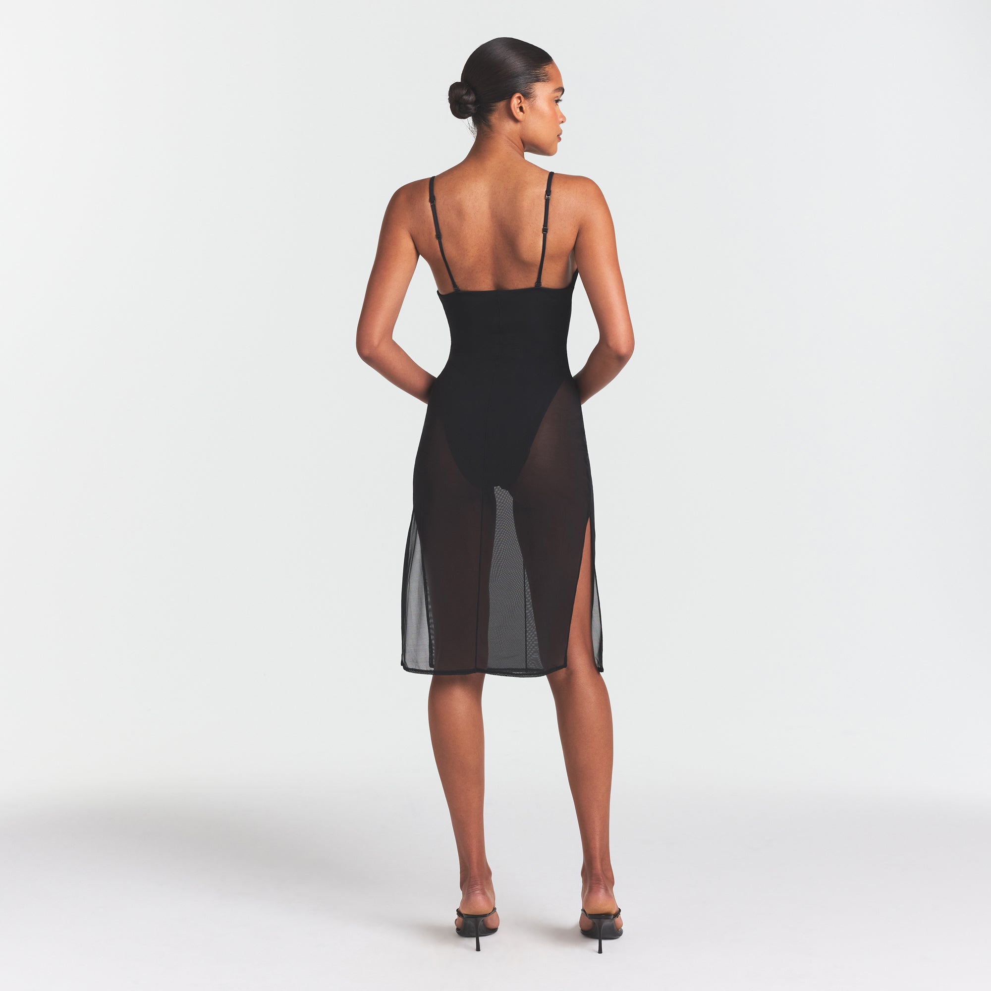 SKIMS BODY MESH PLUNGE MIDI DRESS | ONYX ON A MODEL FRONT VIEW @