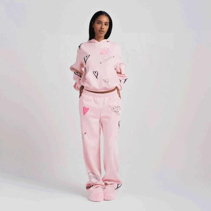 COTTON FLEECE CLASSIC HOODIE | BARELY PINK ANGEL SKETCH ON A MODEL FRONT VIEW @ | FOCUS: 0.0, 1.0, 0.9