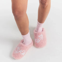 SKIMS ACCESSORIES SHERPA SLIPPER | PEONY SKIMS BOW ON A MODEL SIDE VIEW @ | FOCUS: 0.0, 1.0, 0.9