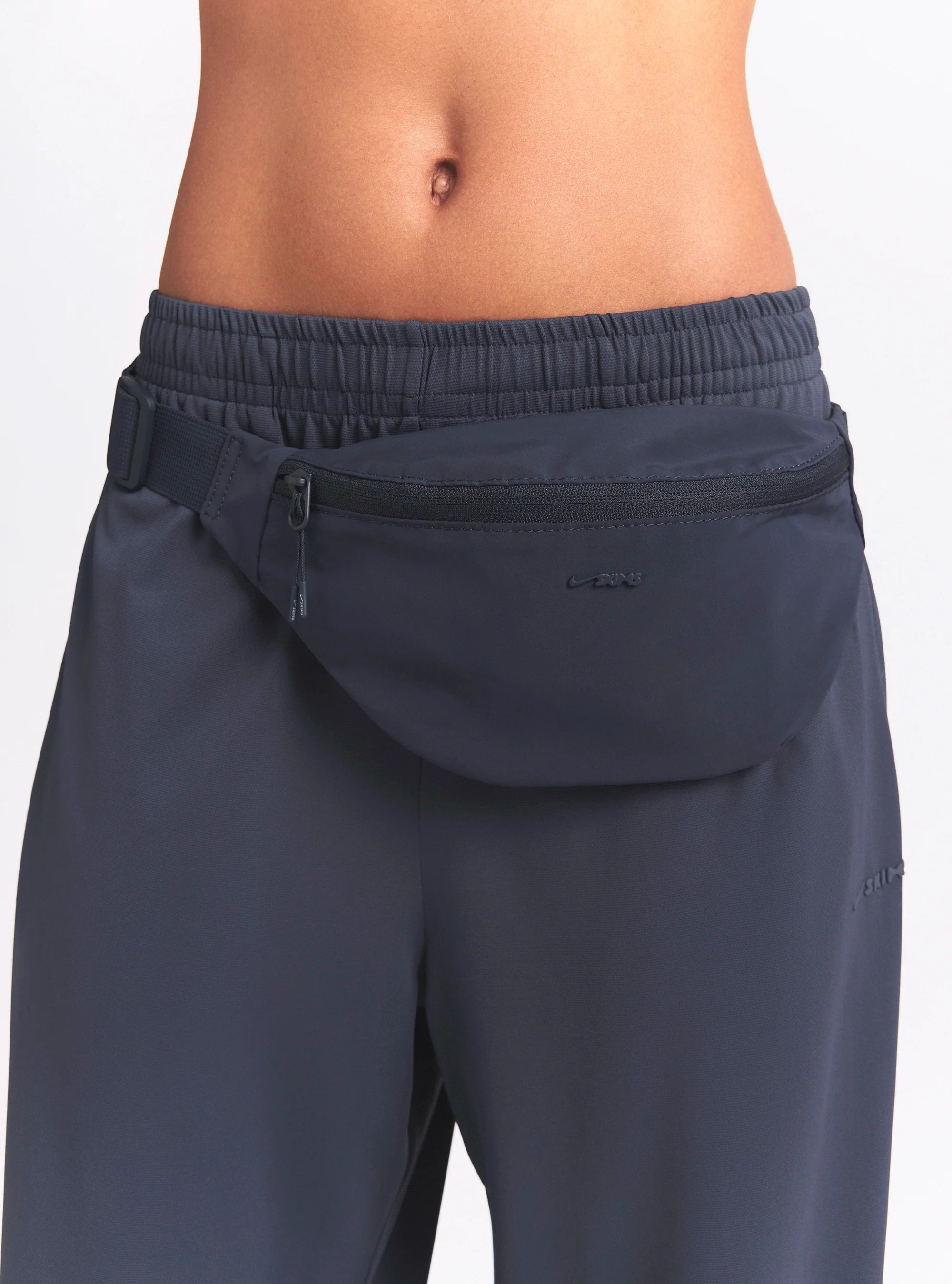 NikeSKIMS ACCESSORIES FANNY PACK | DEEP ROYAL ON A MODEL FRONT VIEW @ | FOCUS: 0.0, 1.0, 0.9