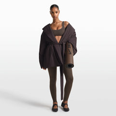 NikeSKIMS ACCESSORIES YOGA MAT | DARK SEPIA ON A MODEL FRONT VIEW @ | FOCUS: 0.0, 1.0, 0.9